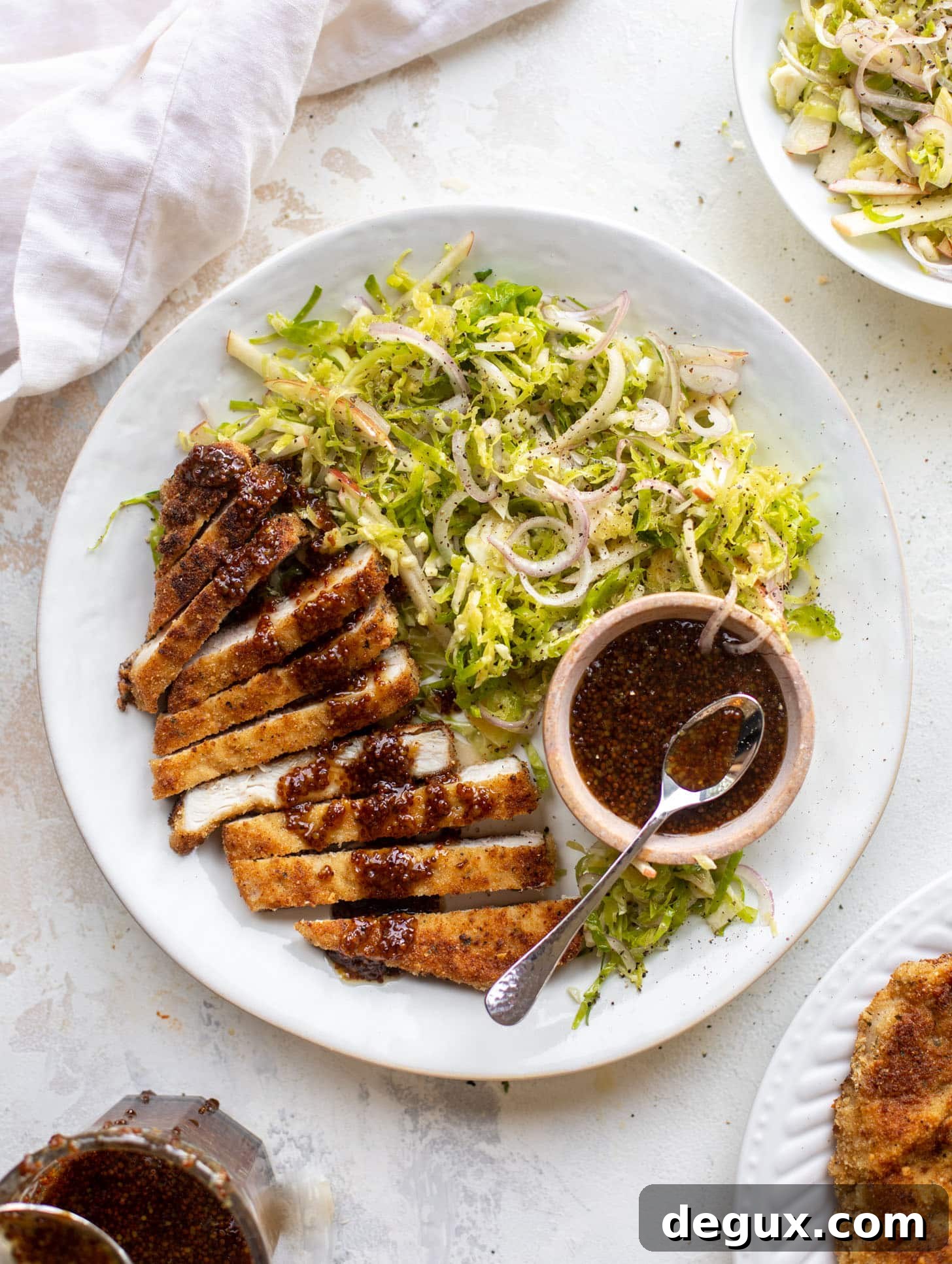 pork schnitzel with carolina gold BBQ sauce & brussels sprouts slaw