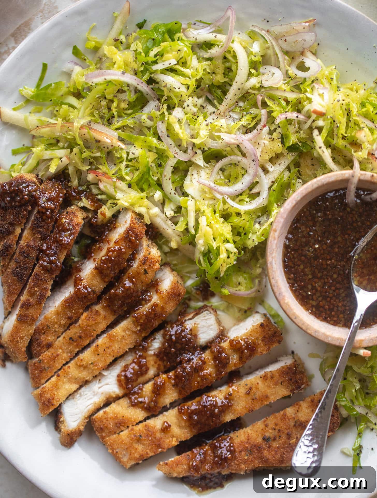 pork schnitzel with carolina gold BBQ sauce & brussels sprouts slaw