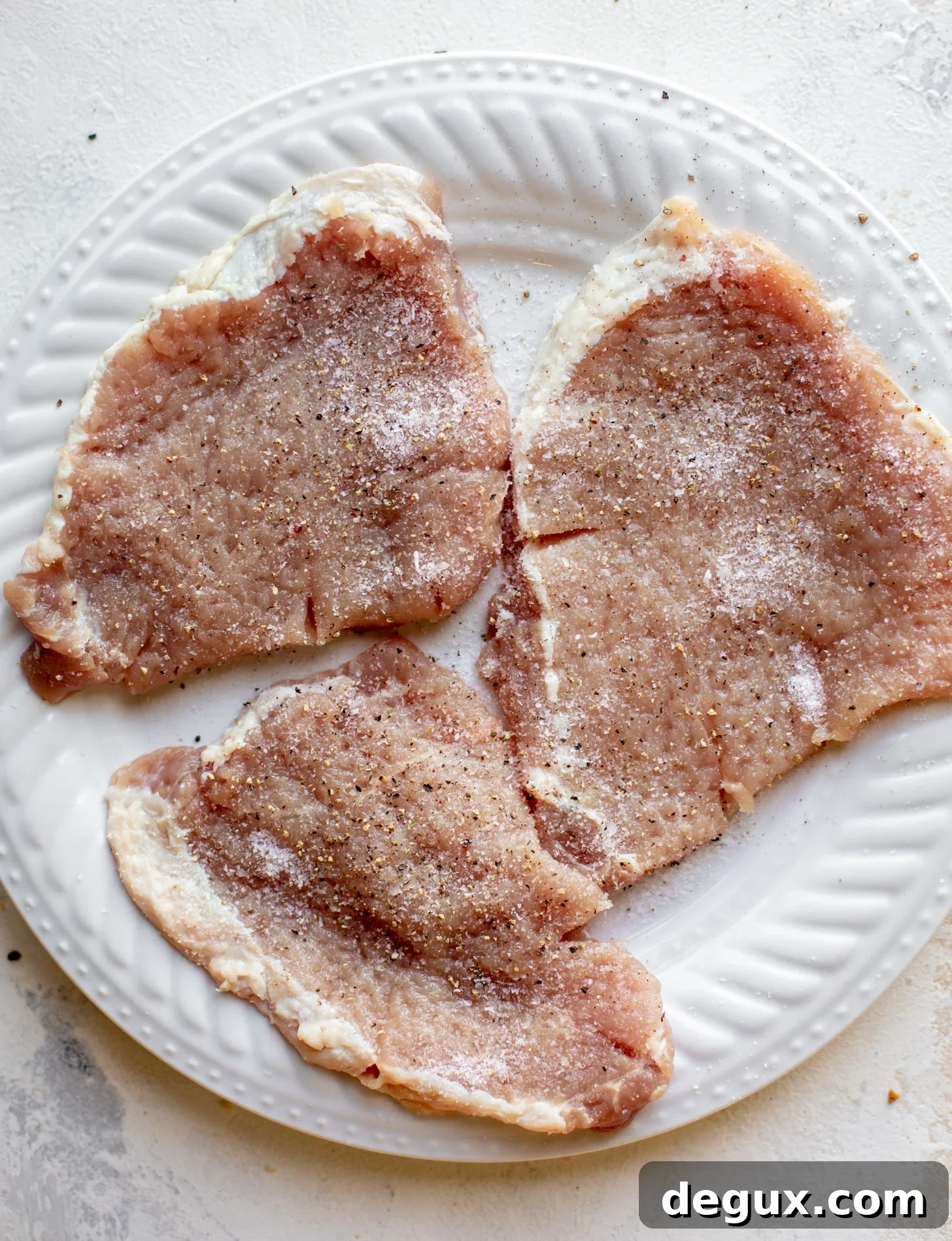 pork chops seasoned with salt and pepper