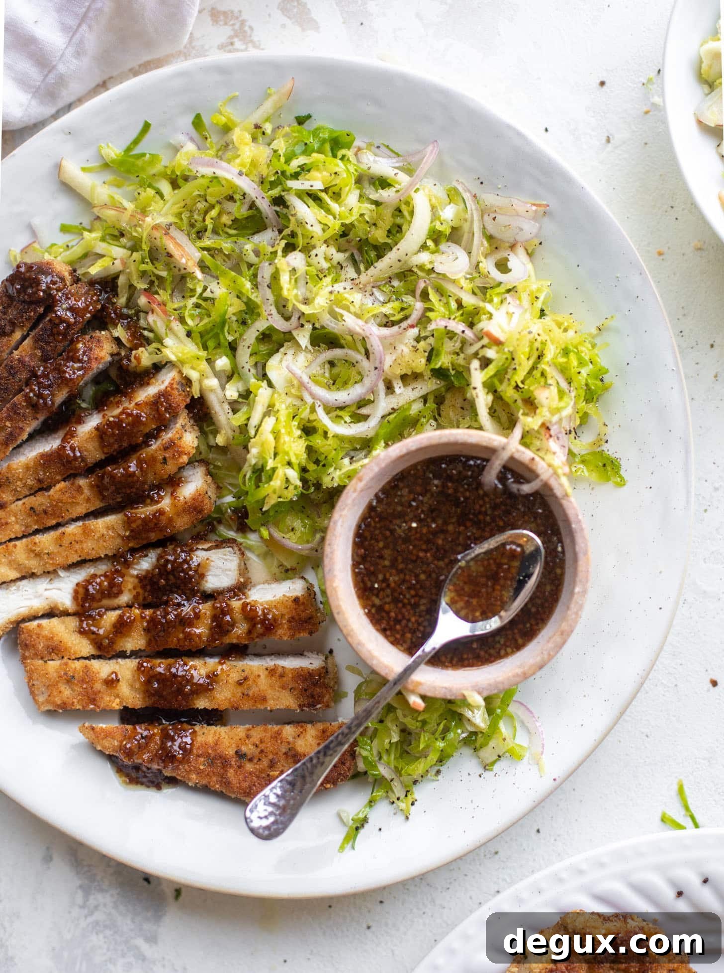 pork schnitzel with carolina gold BBQ sauce & brussels sprouts slaw