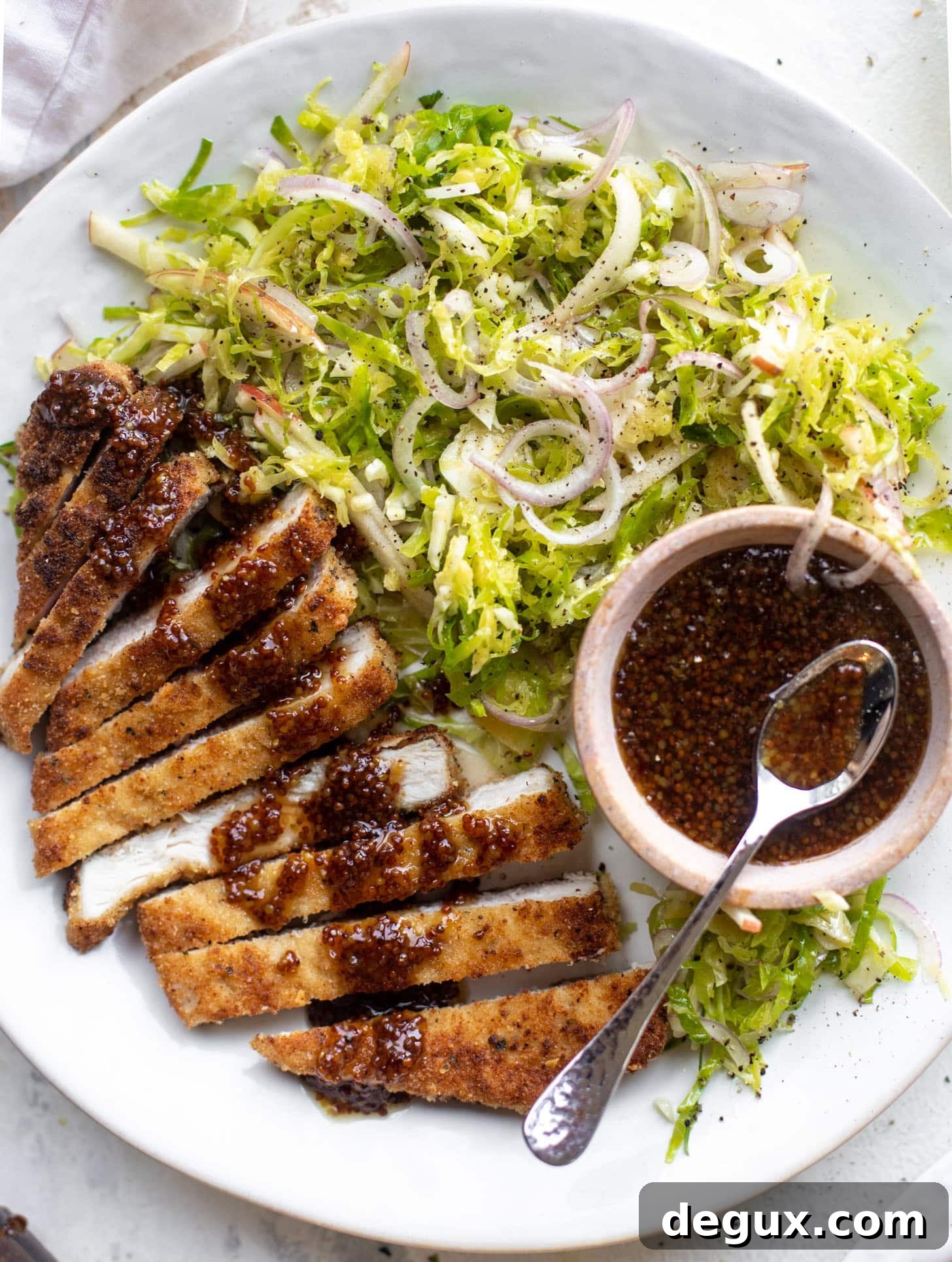 pork schnitzel with carolina gold BBQ sauce & brussels sprouts slaw
