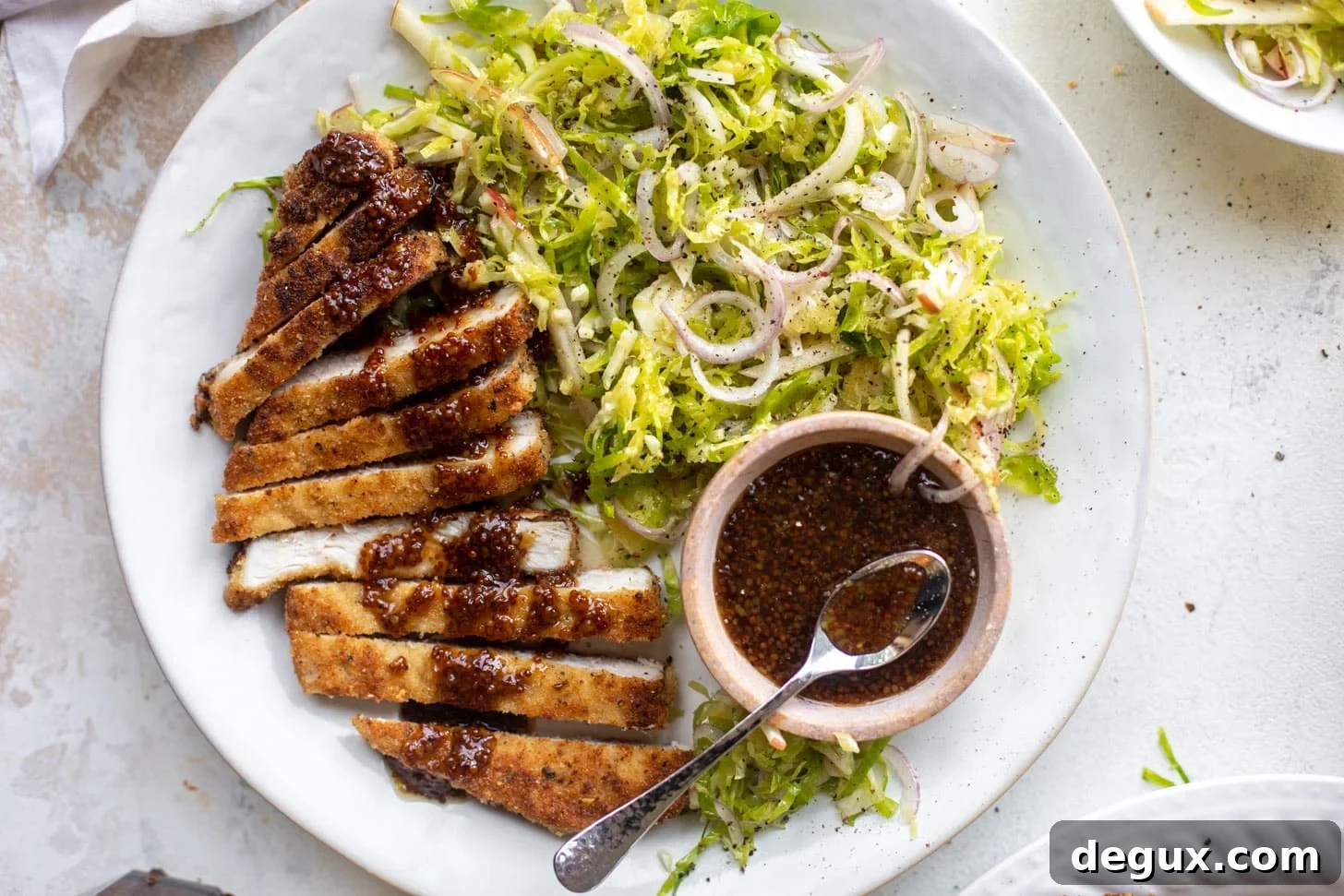 pork schnitzel with carolina gold BBQ sauce & brussels sprouts slaw