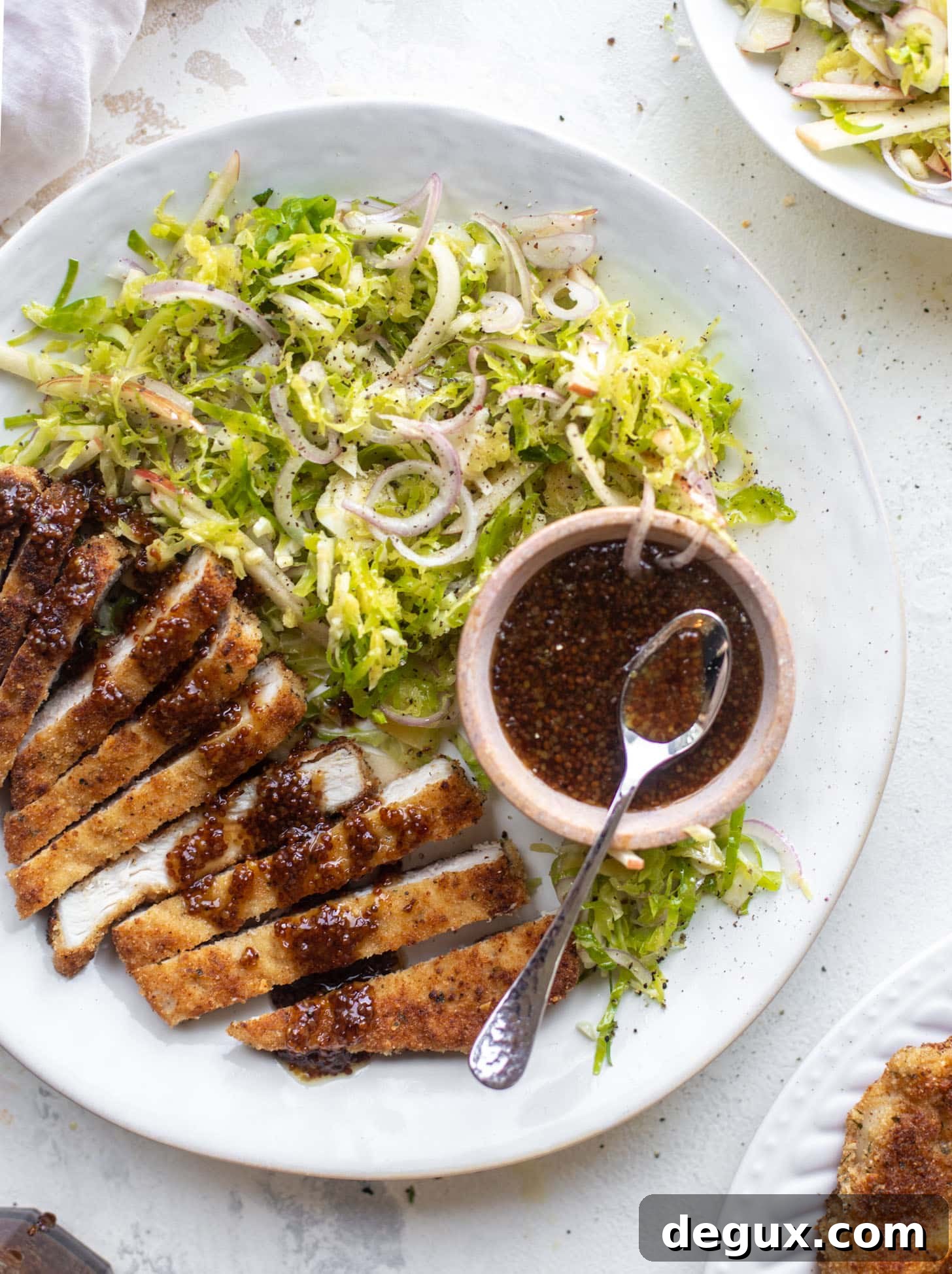 pork schnitzel with carolina gold BBQ sauce & brussels sprouts slaw
