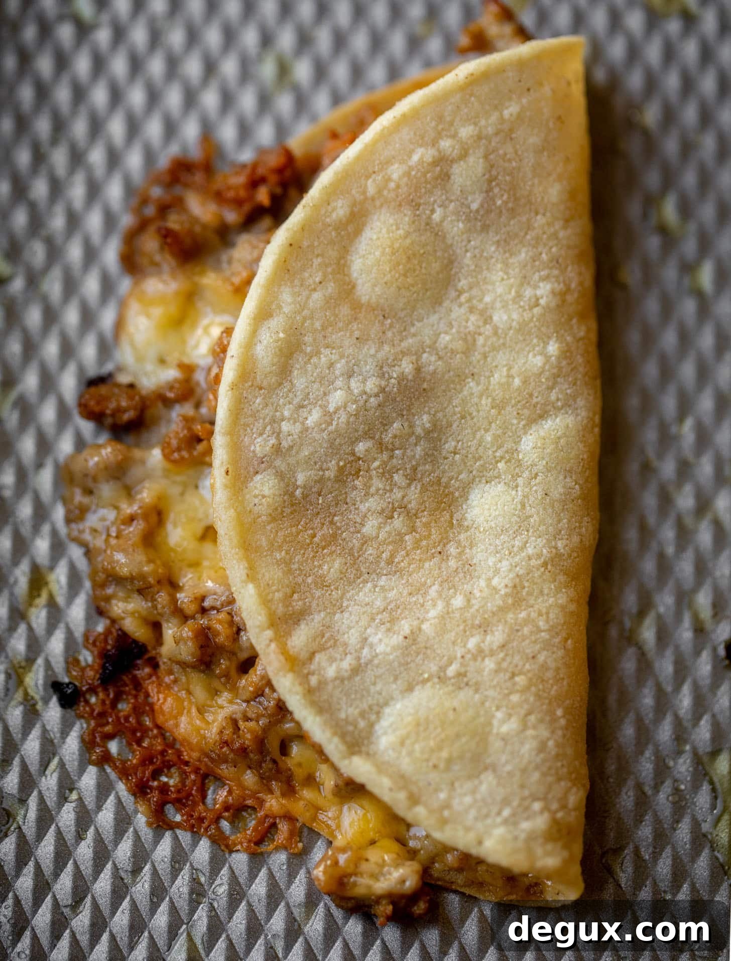 Crispy Baked Cheeseburger Tacos with How Sweet Eats Sauce 5 baked burger tortilla on a sheet pan
