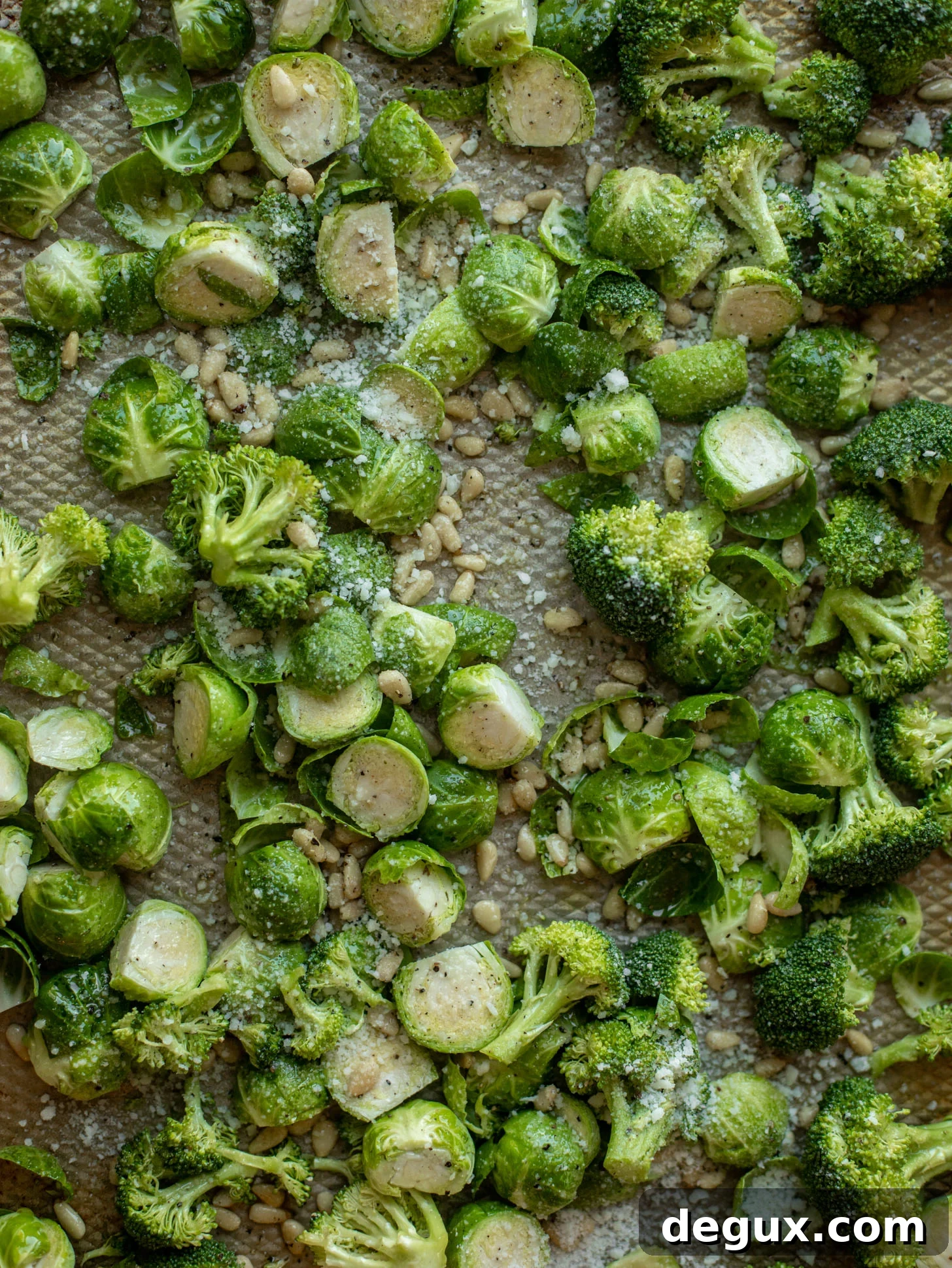 Sticky Pomegranate Salmon with Roasted Brussels Sprouts & Broccoli 4 broccoli and brussels sprouts on a baking sheet