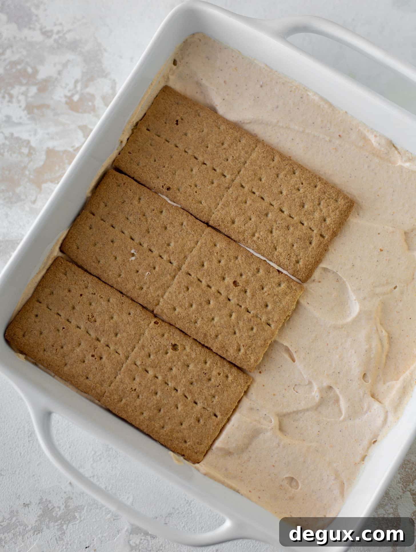 layers of graham crackers on pumpkin cream