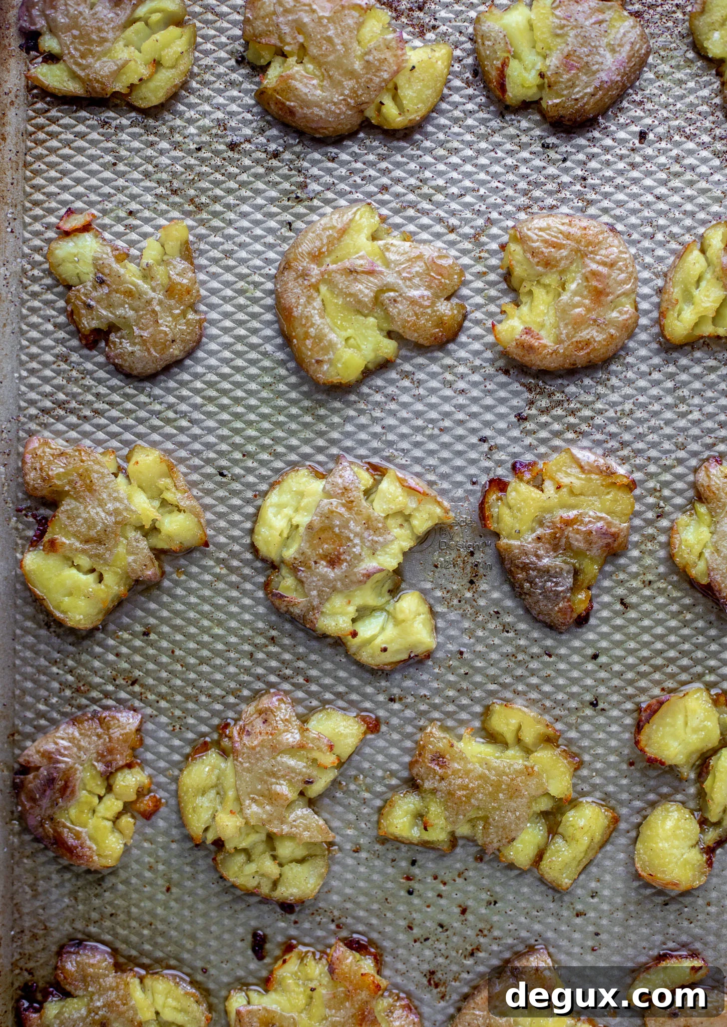 smashed potatoes on baking sheet