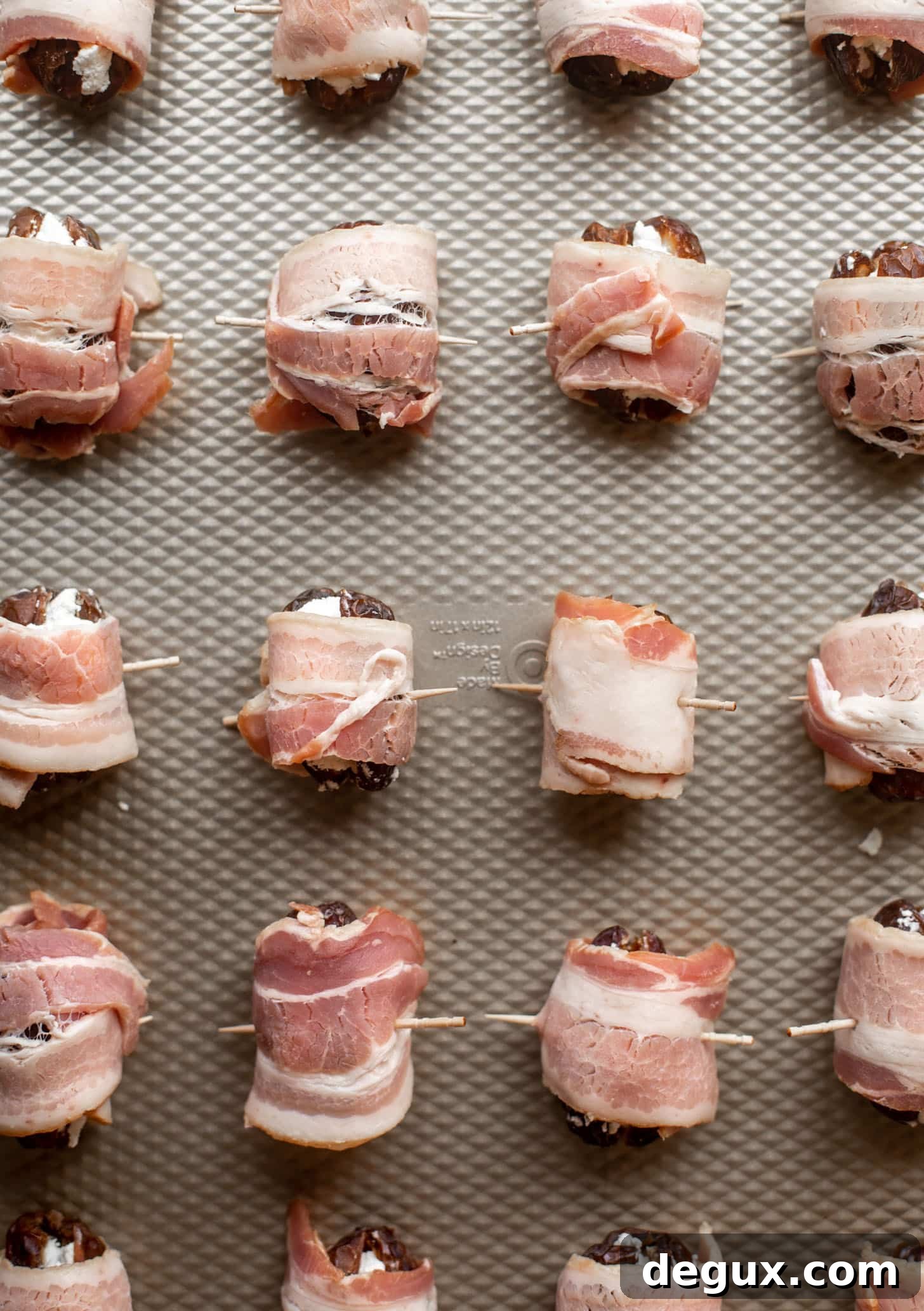 bacon wrapped goat cheese stuffed dates ready for the oven