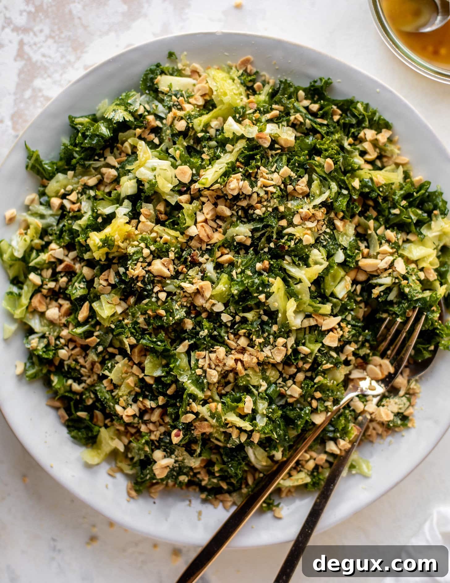 crunchy emerald kale salad with peanut vinaigrette
