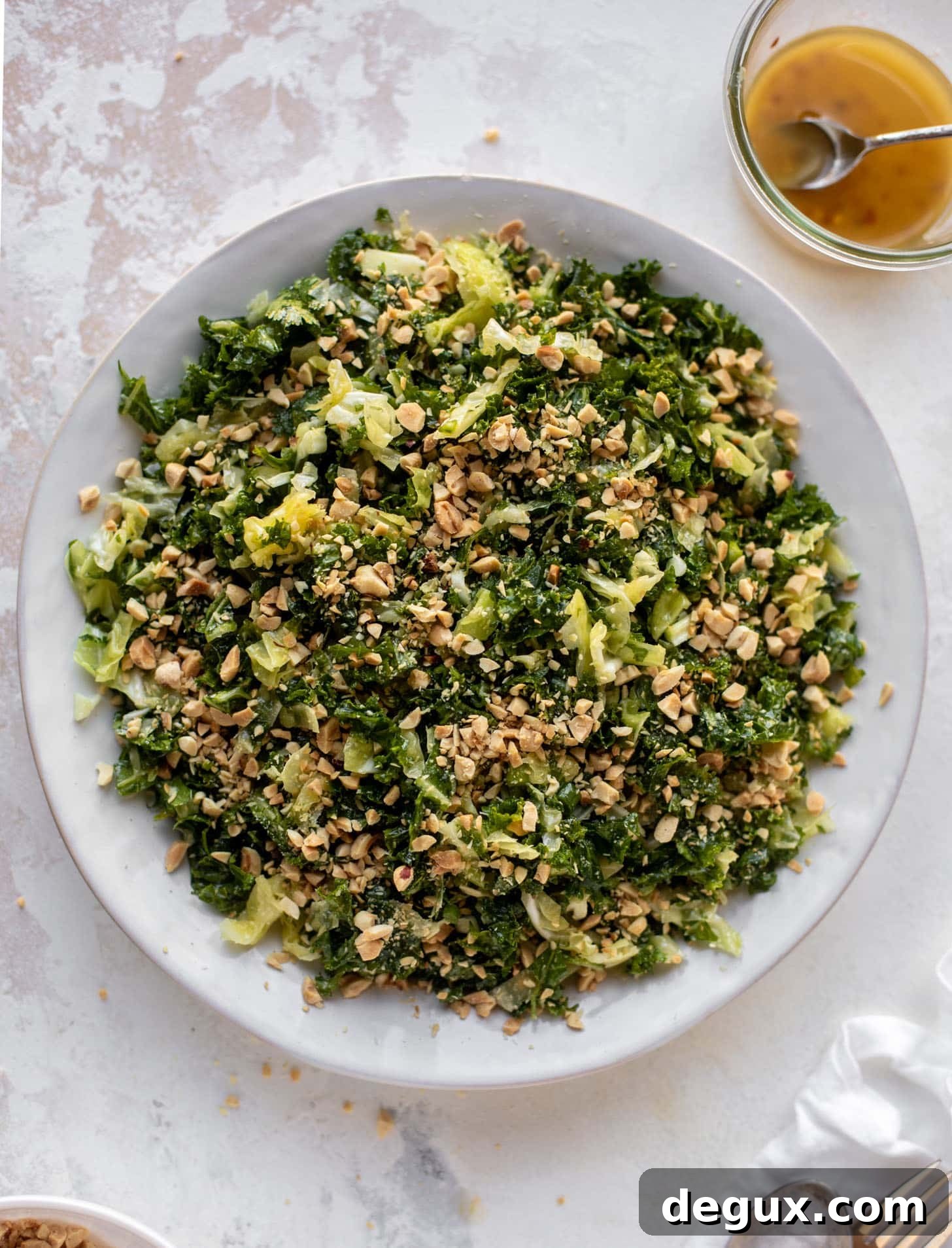 crunchy emerald kale salad with peanut vinaigrette