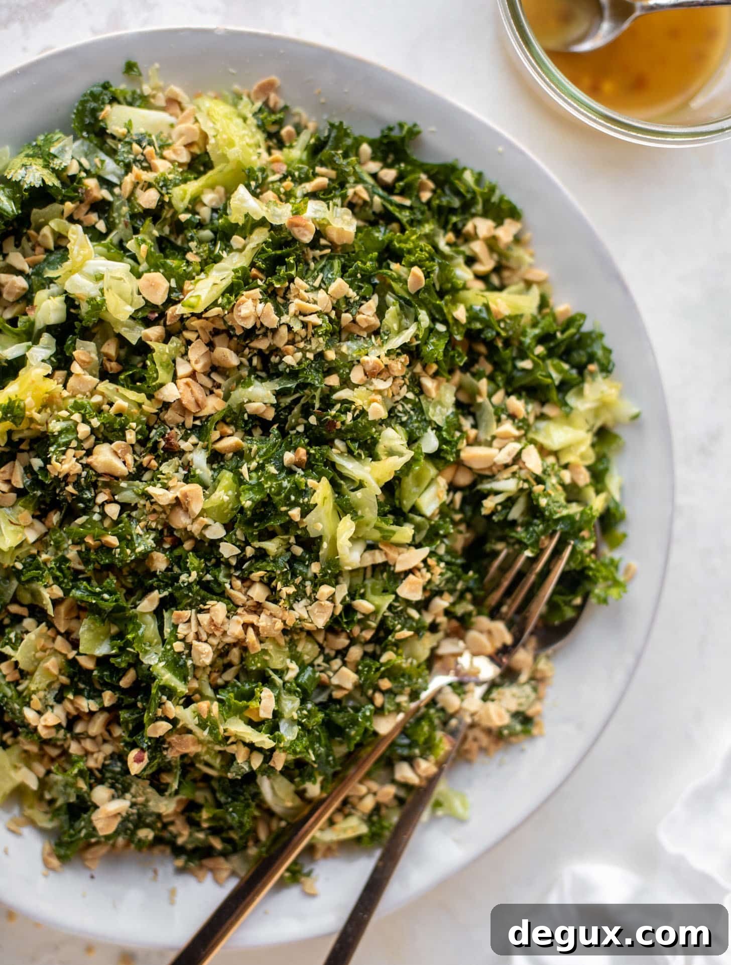 crunchy emerald kale salad with peanut vinaigrette