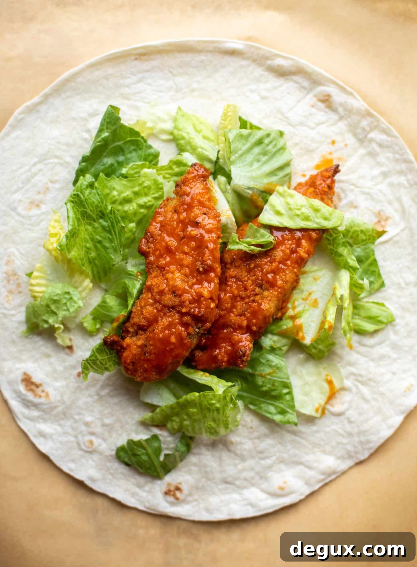 tortilla with lettuce and buffalo chicken