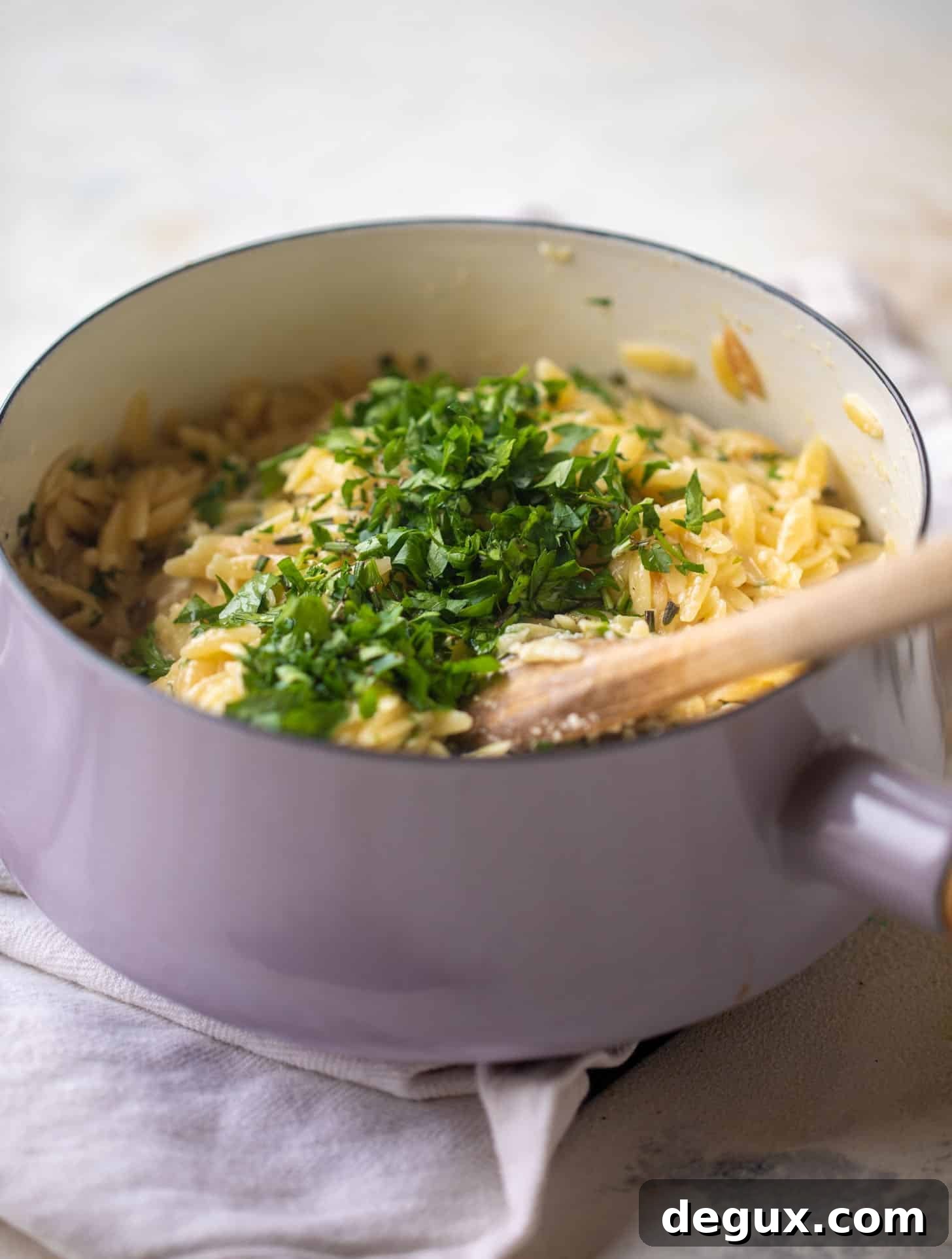Parmesan Herb Orzo Recipe — Creamy Italian-Style Side Dish 5 cooked orzo in a pot with fresh herbs