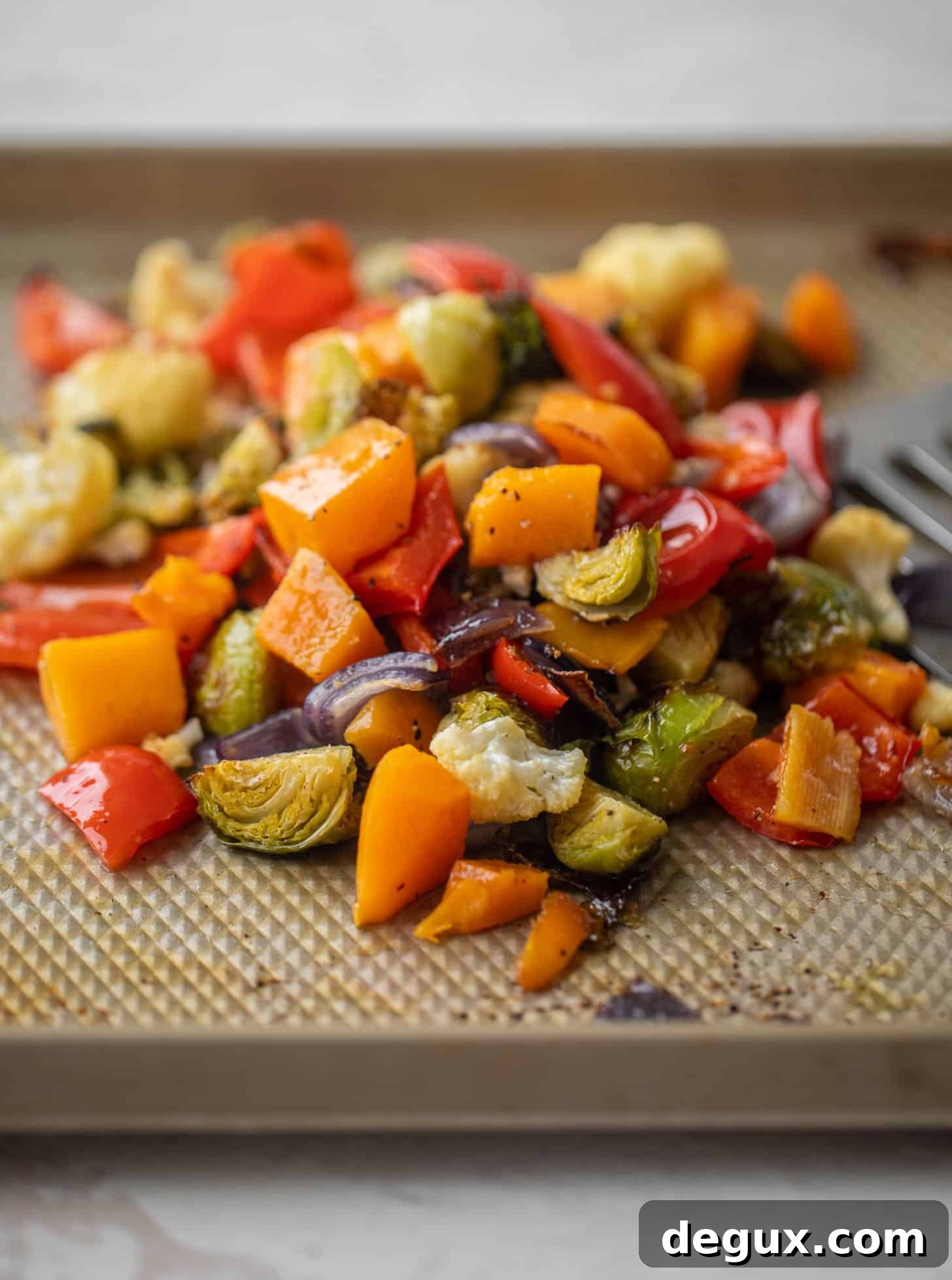 Winter Vegetable and Goat Cheese Galette Recipe for Cozy Nights 6 roasted vegetables on a baking sheet