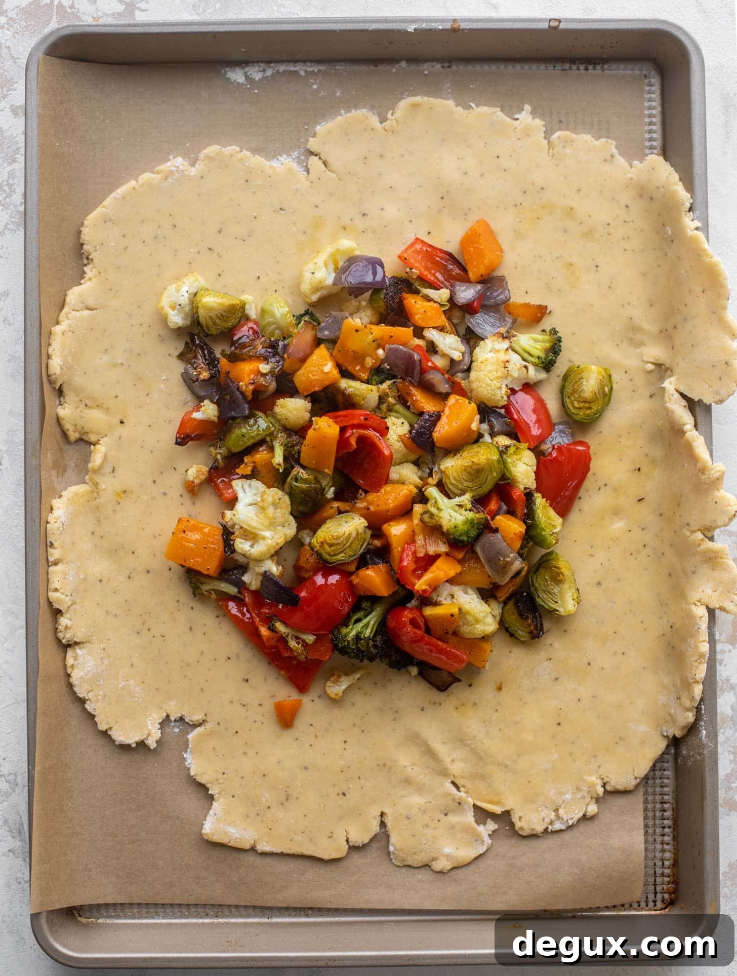 Winter Vegetable and Goat Cheese Galette Recipe for Cozy Nights 7 pie dough topped with roasted vegetables
