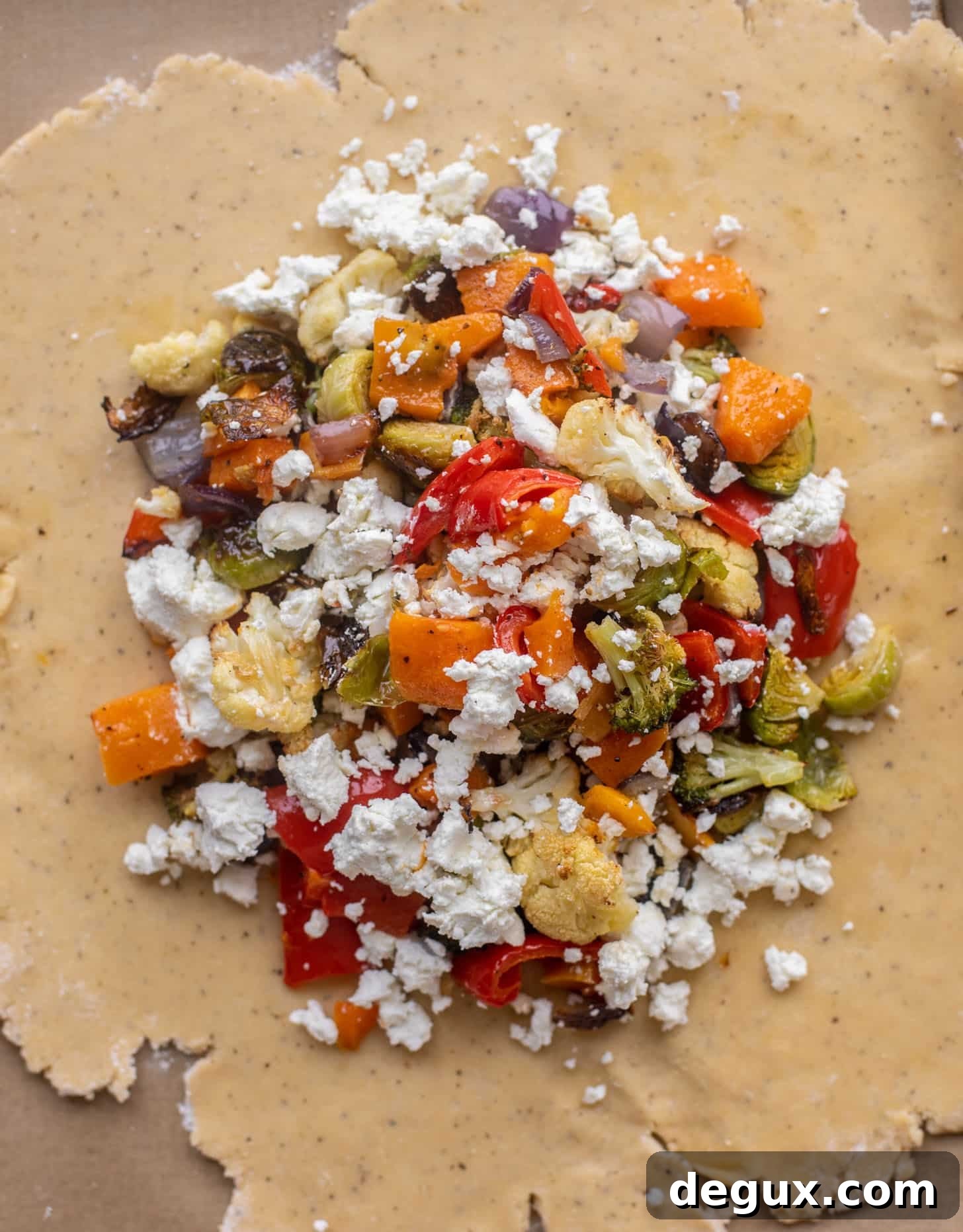 Winter Vegetable and Goat Cheese Galette Recipe for Cozy Nights 8 pie dough topped with vegetables and goat cheese