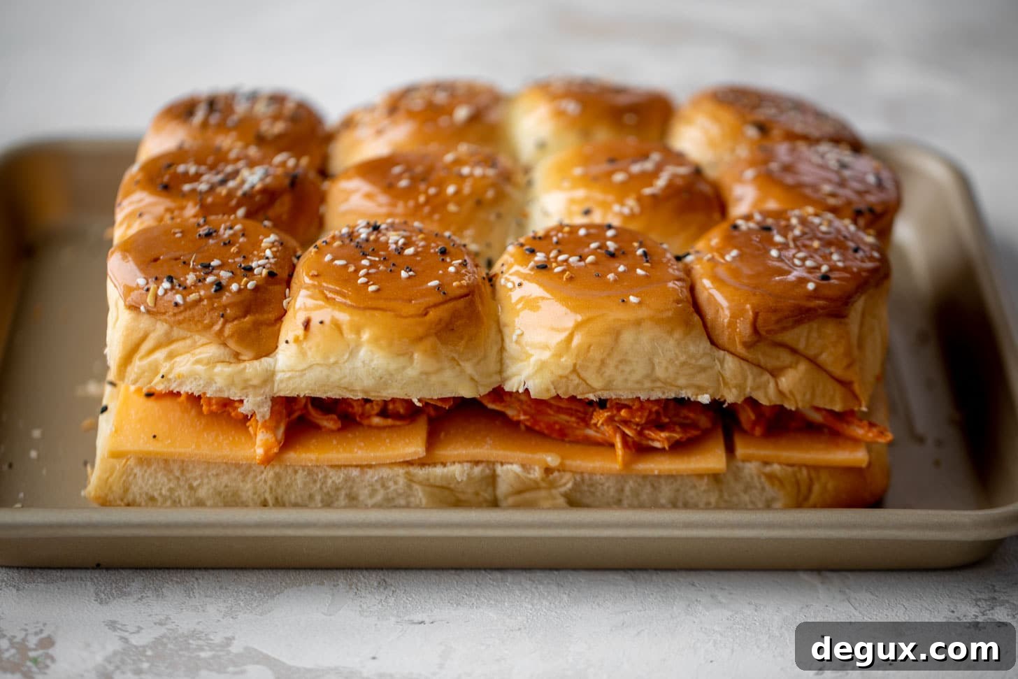 Buffalo Chicken Pull-Apart Sliders with Gorgonzola Slaw 5 pull-apart buffalo chicken sliders ready for the oven
