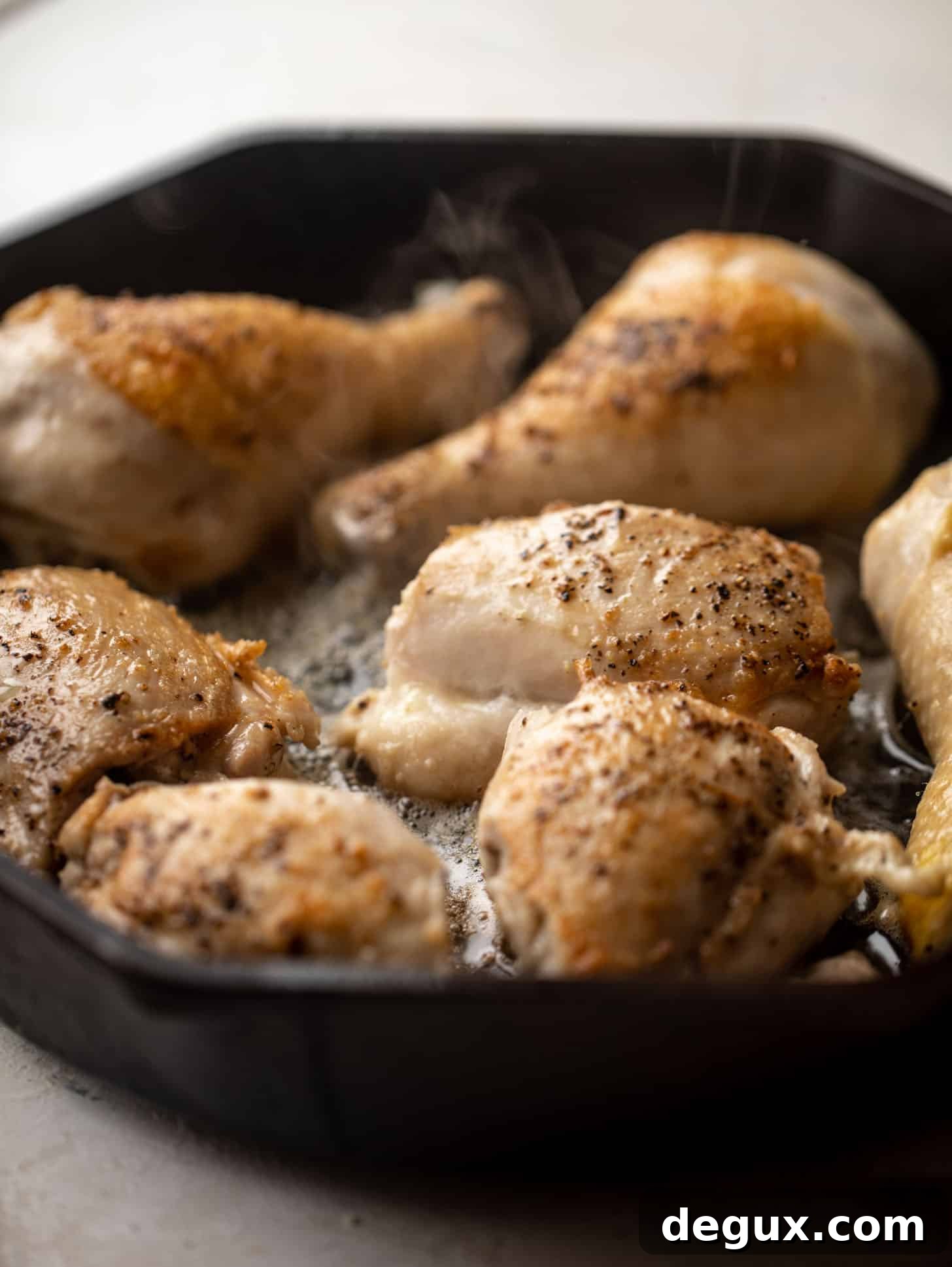 seared chicken in a cast iron skillet