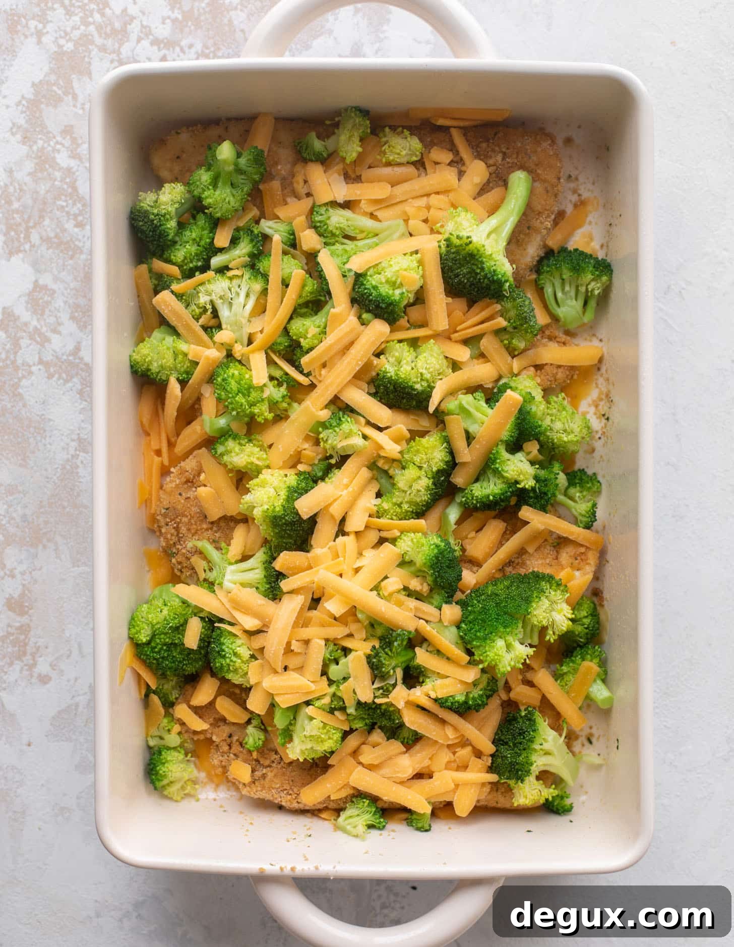 crispy broccoli cheddar melt chicken ready for the oven