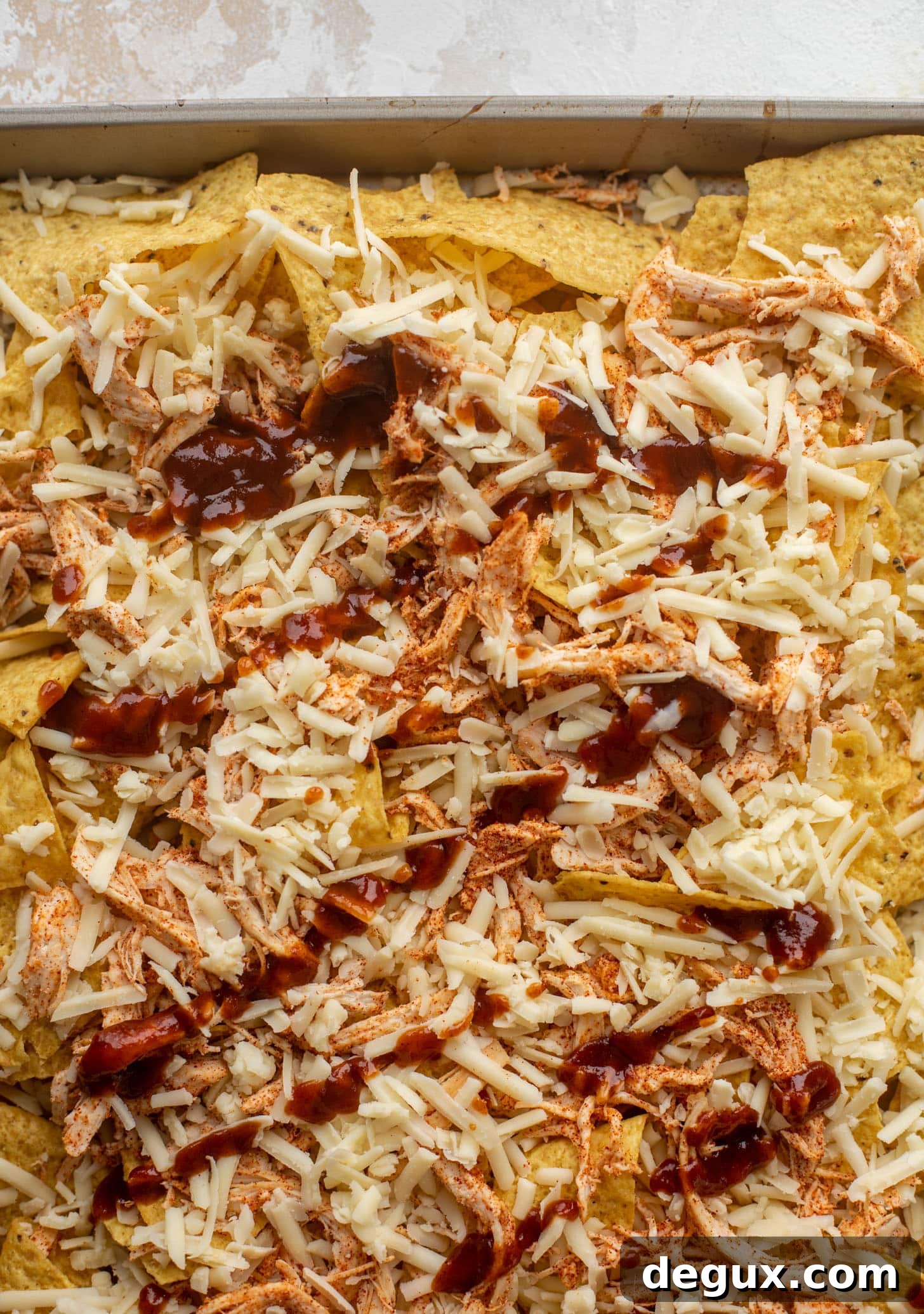 Chipotle Honey BBQ Chicken Nachos with Mango Pico de Gallo 3 chips with chicken, cheese, bbq sauce