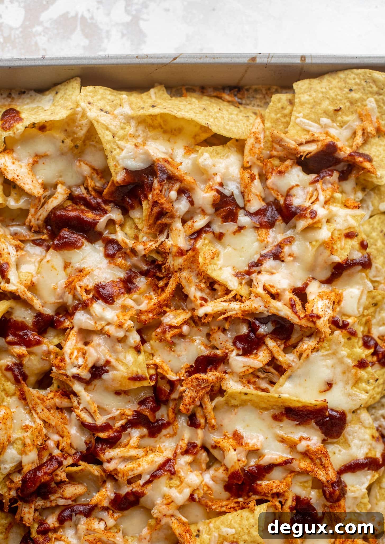 Chipotle Honey BBQ Chicken Nachos with Mango Pico de Gallo 5 chips with melted cheese, chicken, bbq sauce