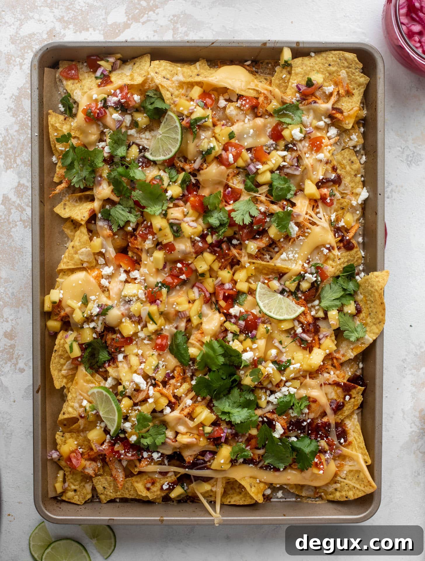Chipotle Honey BBQ Chicken Nachos with Mango Pico de Gallo 6 hot honey chipotle BBQ chicken nachos