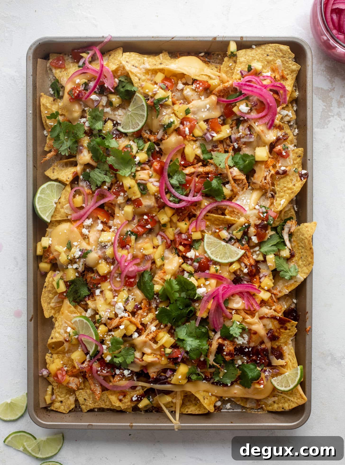 Chipotle Honey BBQ Chicken Nachos with Mango Pico de Gallo 10 hot honey chipotle BBQ chicken nachos