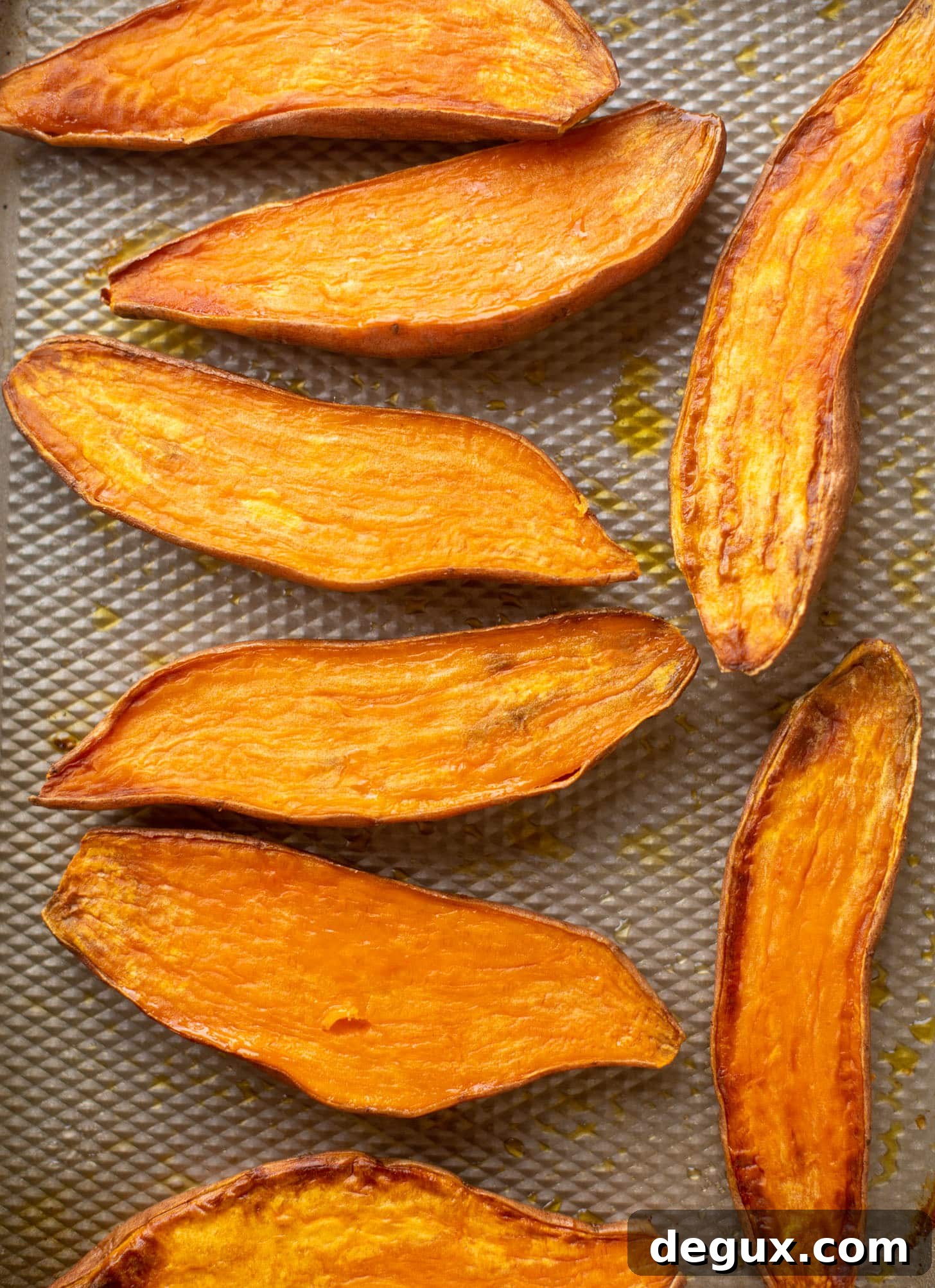 slow roasted sweet potatoes on a baking sheet
