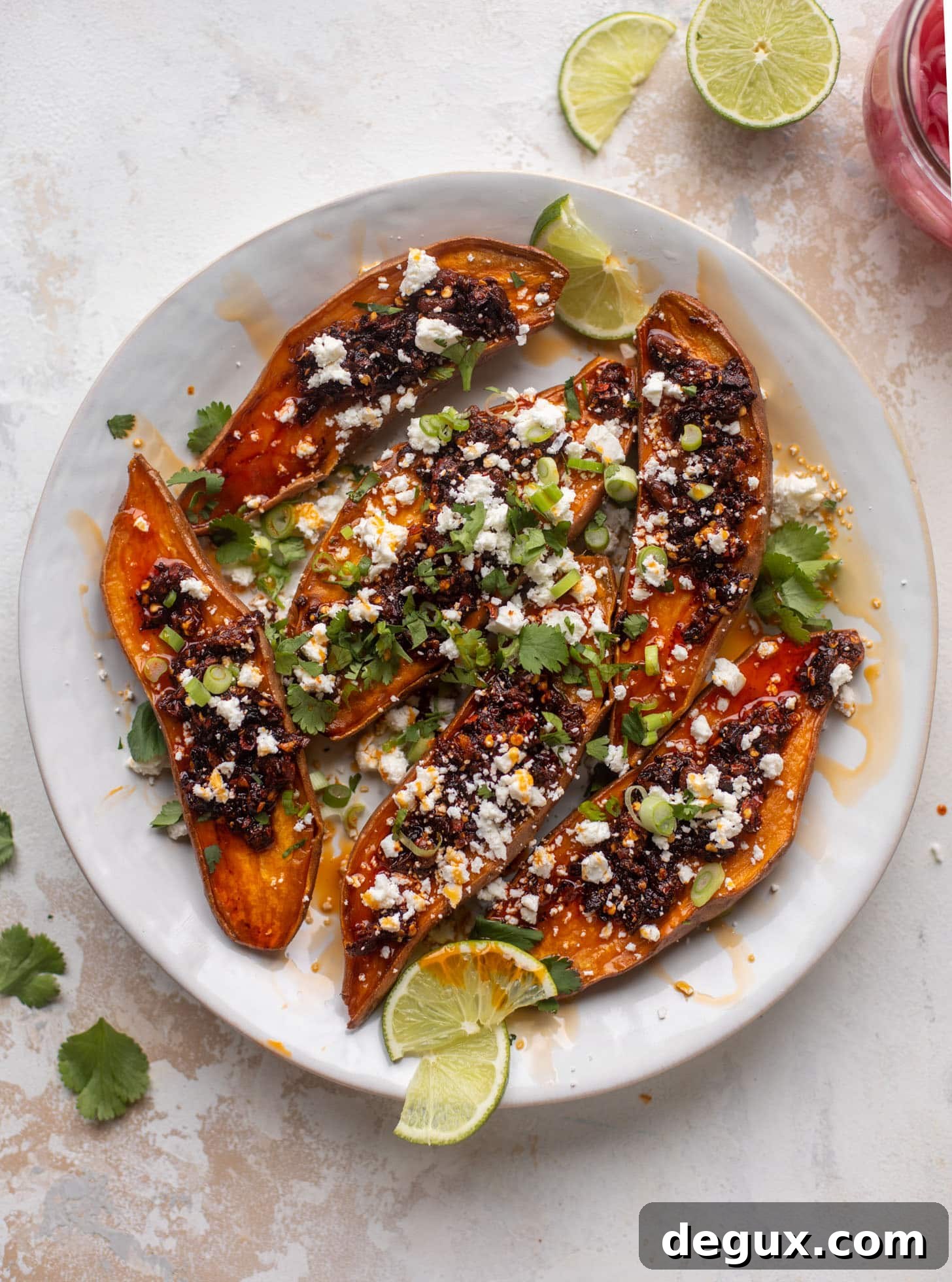 chili crisp sweet potatoes with feta and herbs