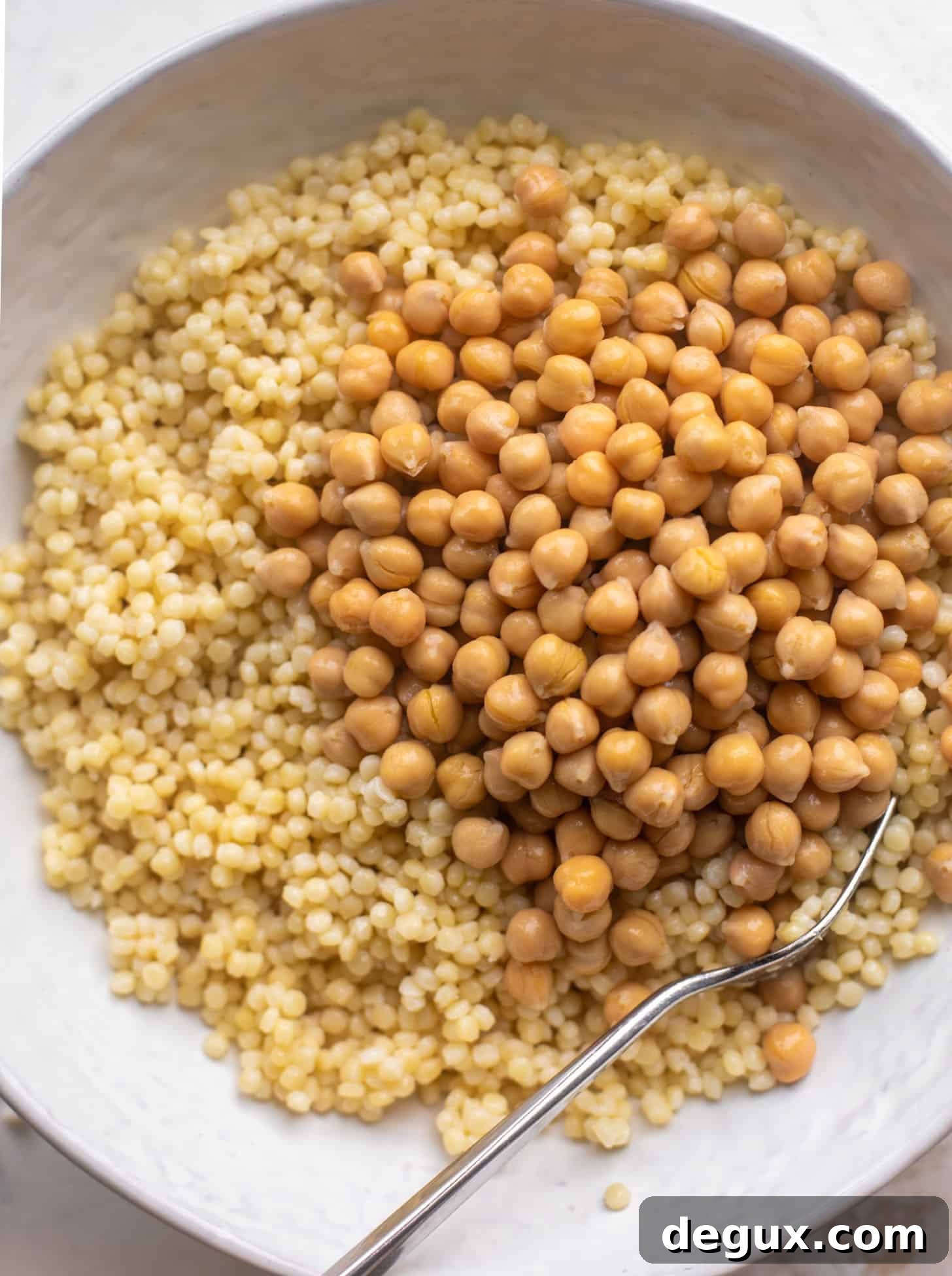 Spring Couscous Bowls with Lemon-Feta Vinaigrette Recipe 3 couscous and chickpeas in a bowl