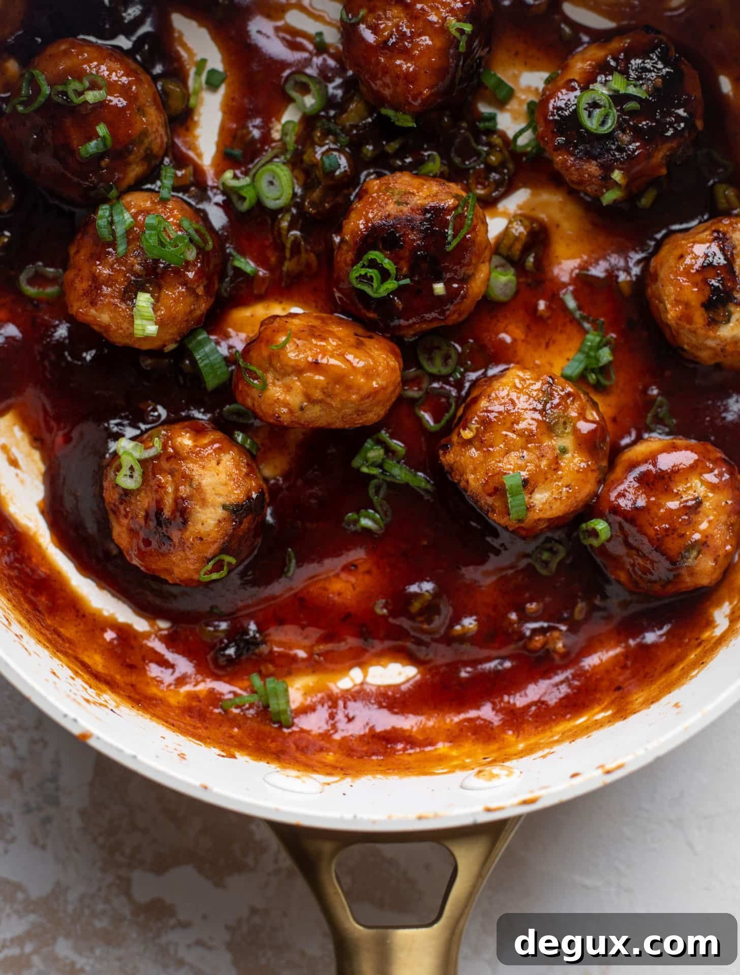 sticky BBQ chicken meatballs in a pan