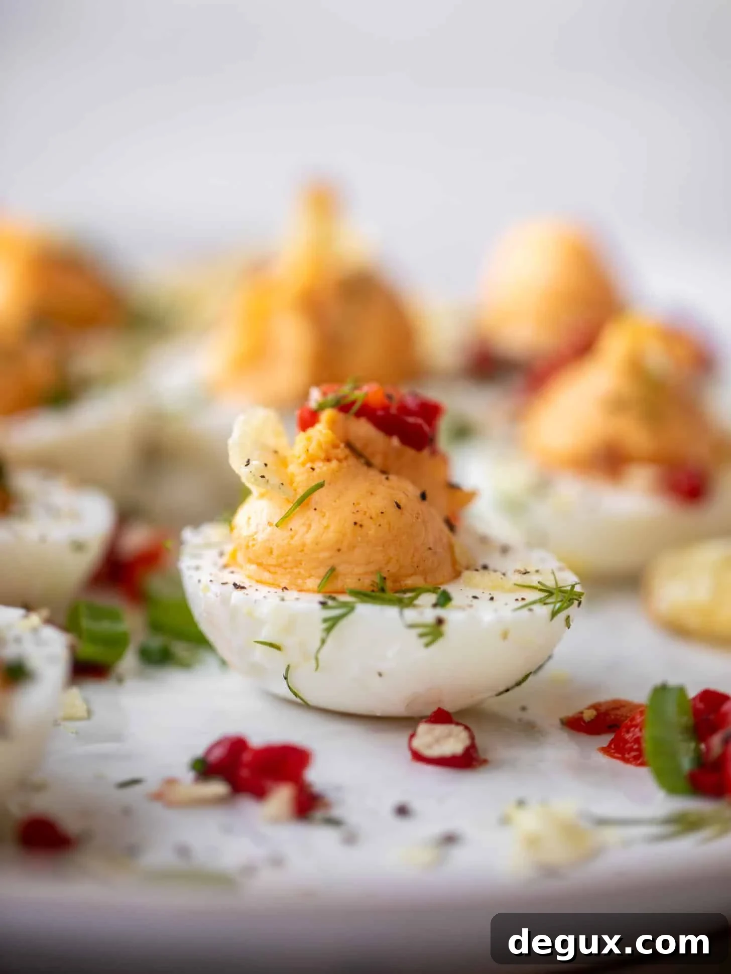 Pimento Cheese Deviled Eggs Topped with Crushed Potato Chips 2 pimento cheese deviled eggs