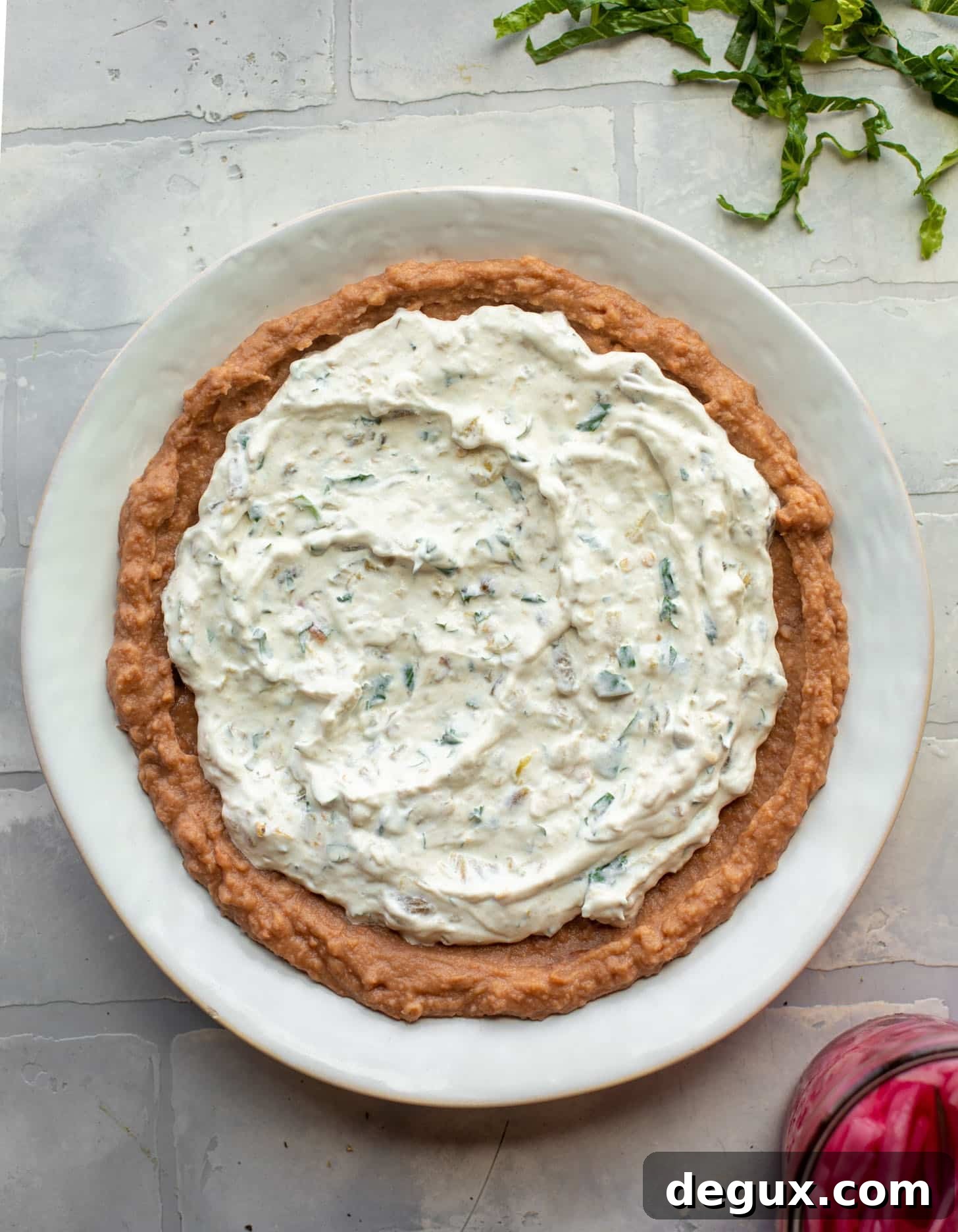 refried beans + sour cream + salsa verde