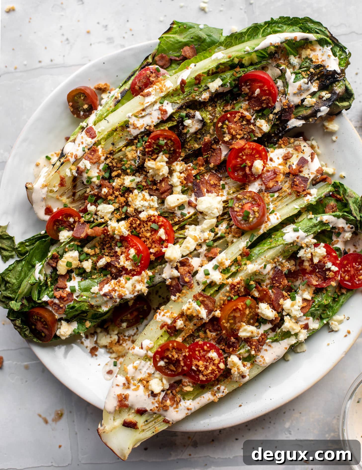 Grilled Romaine Salad Recipes You’ll Crave 2 grilled romaine salads with tomatoes, bacon and ranch