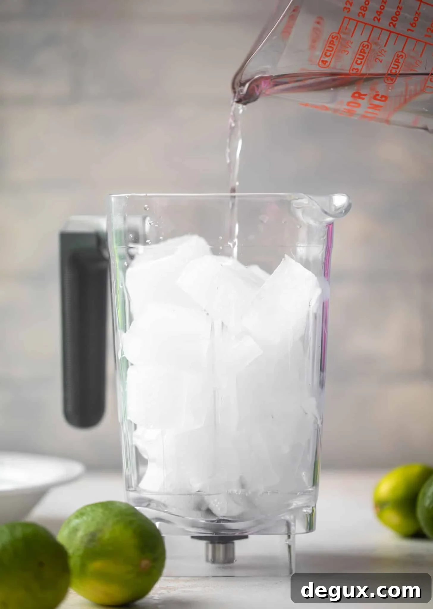 pouring gin in the blender