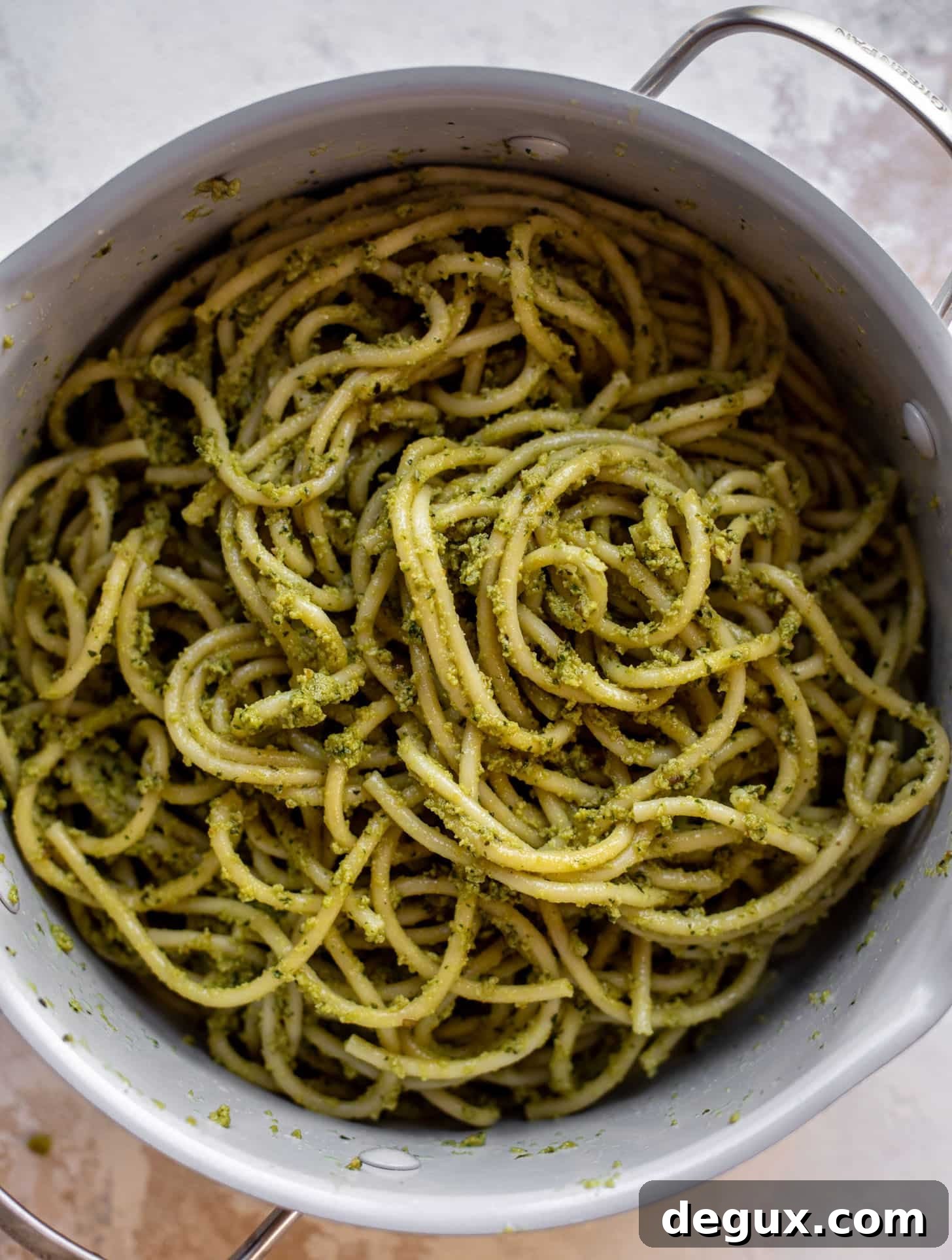 Creamy Avocado Pesto Pasta Recipe for Quick Weeknight Meals 6 bucatini pesto in a pot