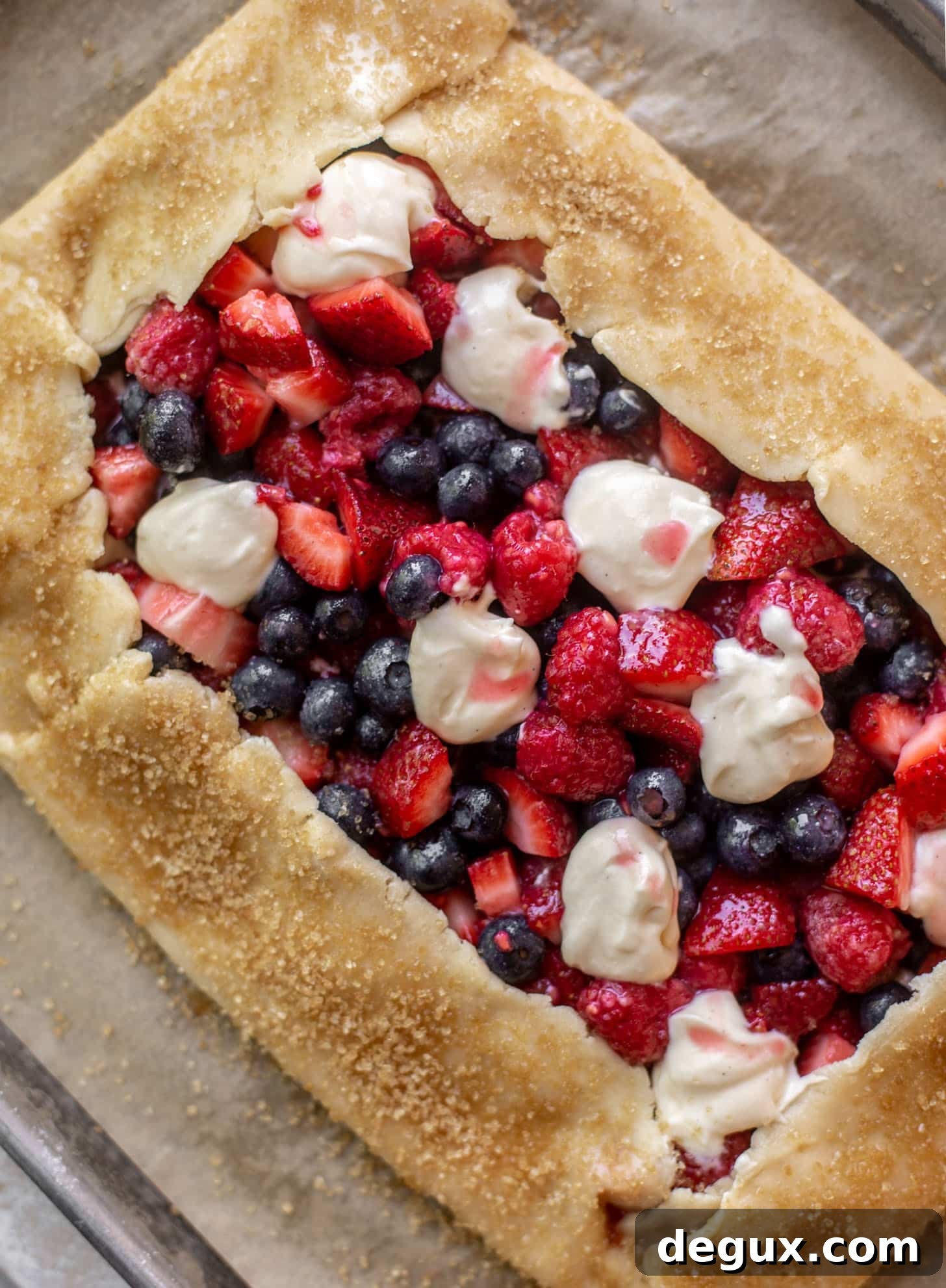 triple berry cheesecake galette ready for the oven