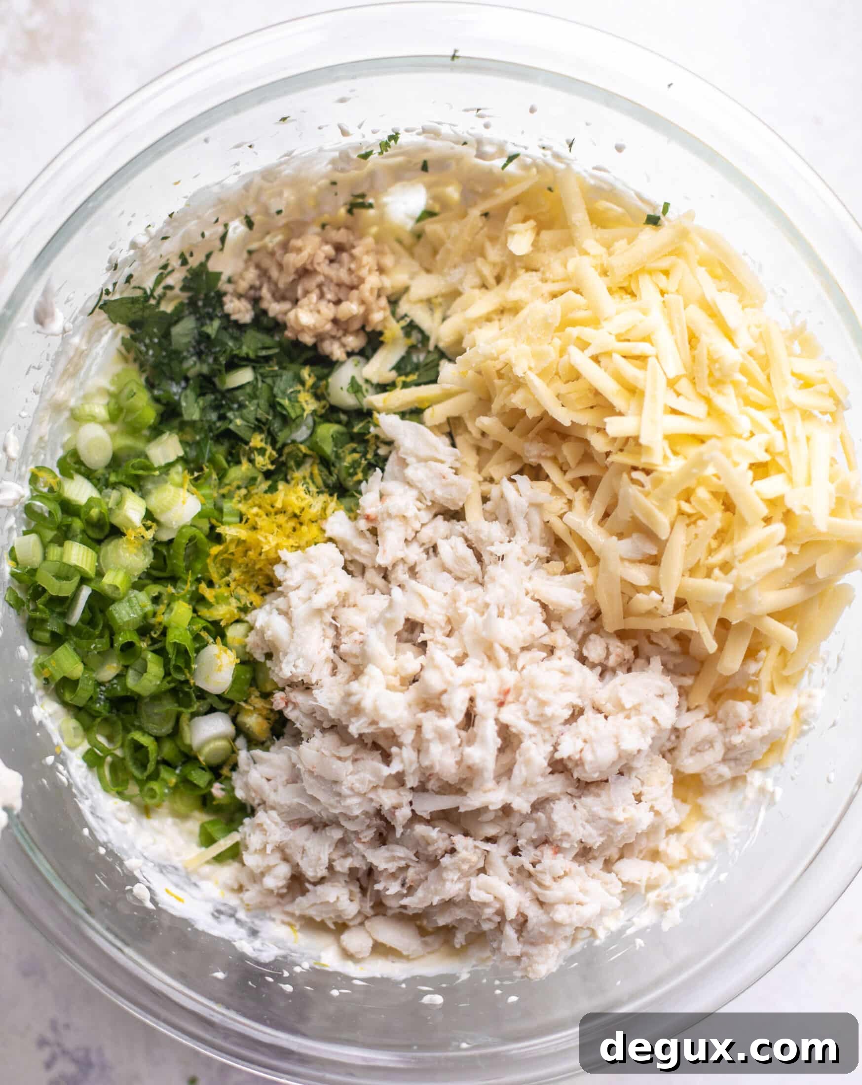 Old Bay Crab Dip with Crispy Crostini Recipe 5 bowl of crab, herbs, scallions, cheese, lemon zest, garlic