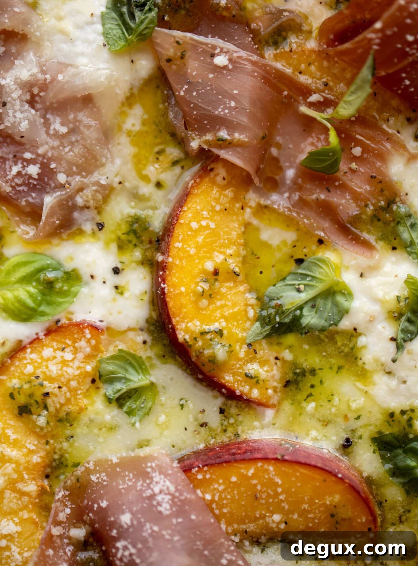 pesto peach pizza with prosciutto and burrata