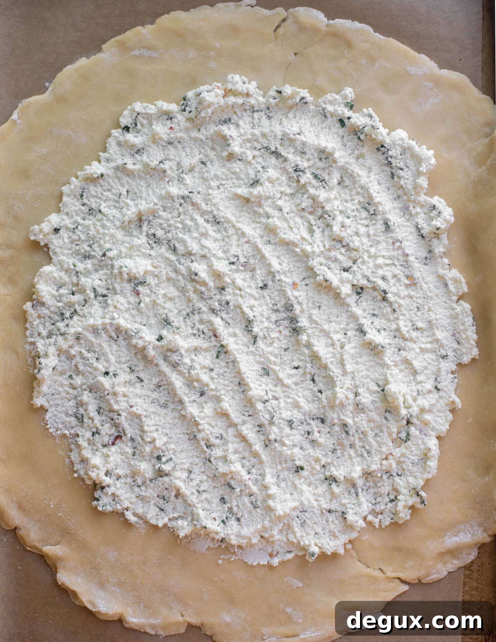 pie crust spread with ricotta cheese