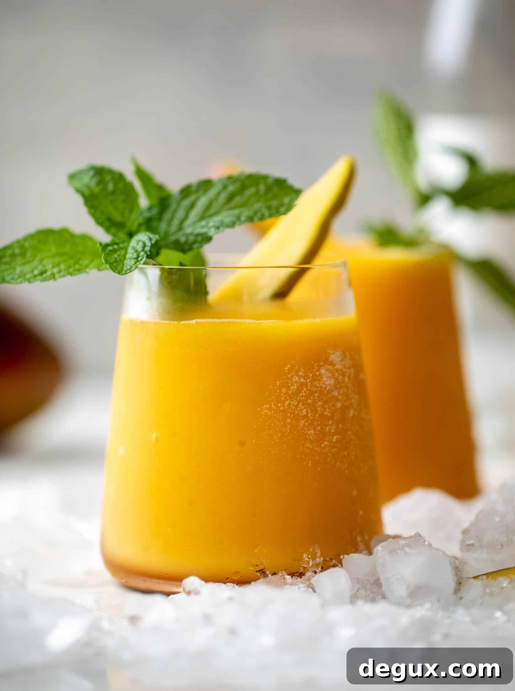 Mango Frosé: Refreshing Frozen Rosé Cocktail Recipe 5 Pouring mango frosé