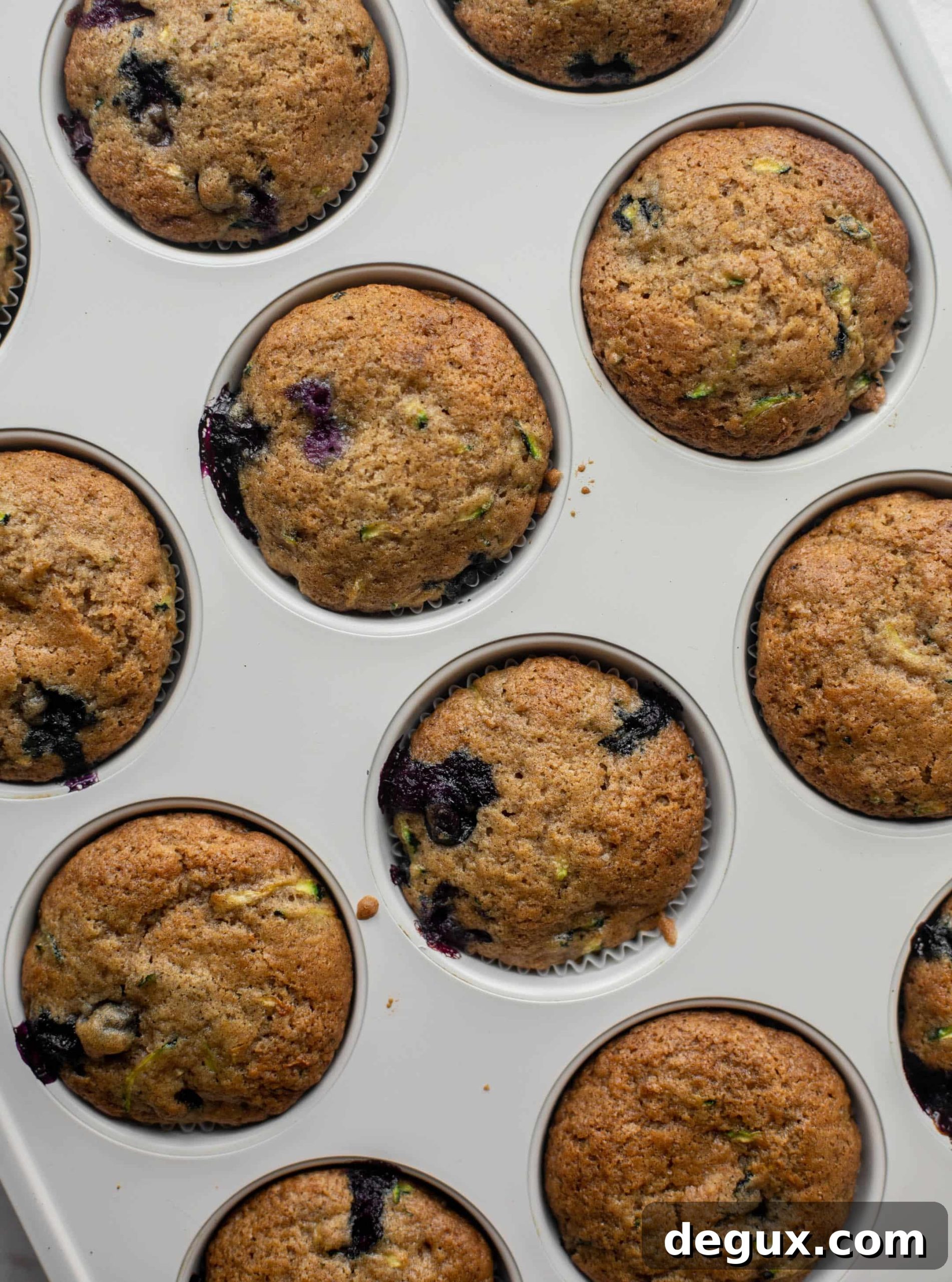 blueberry zucchini muffins with lemon glaze