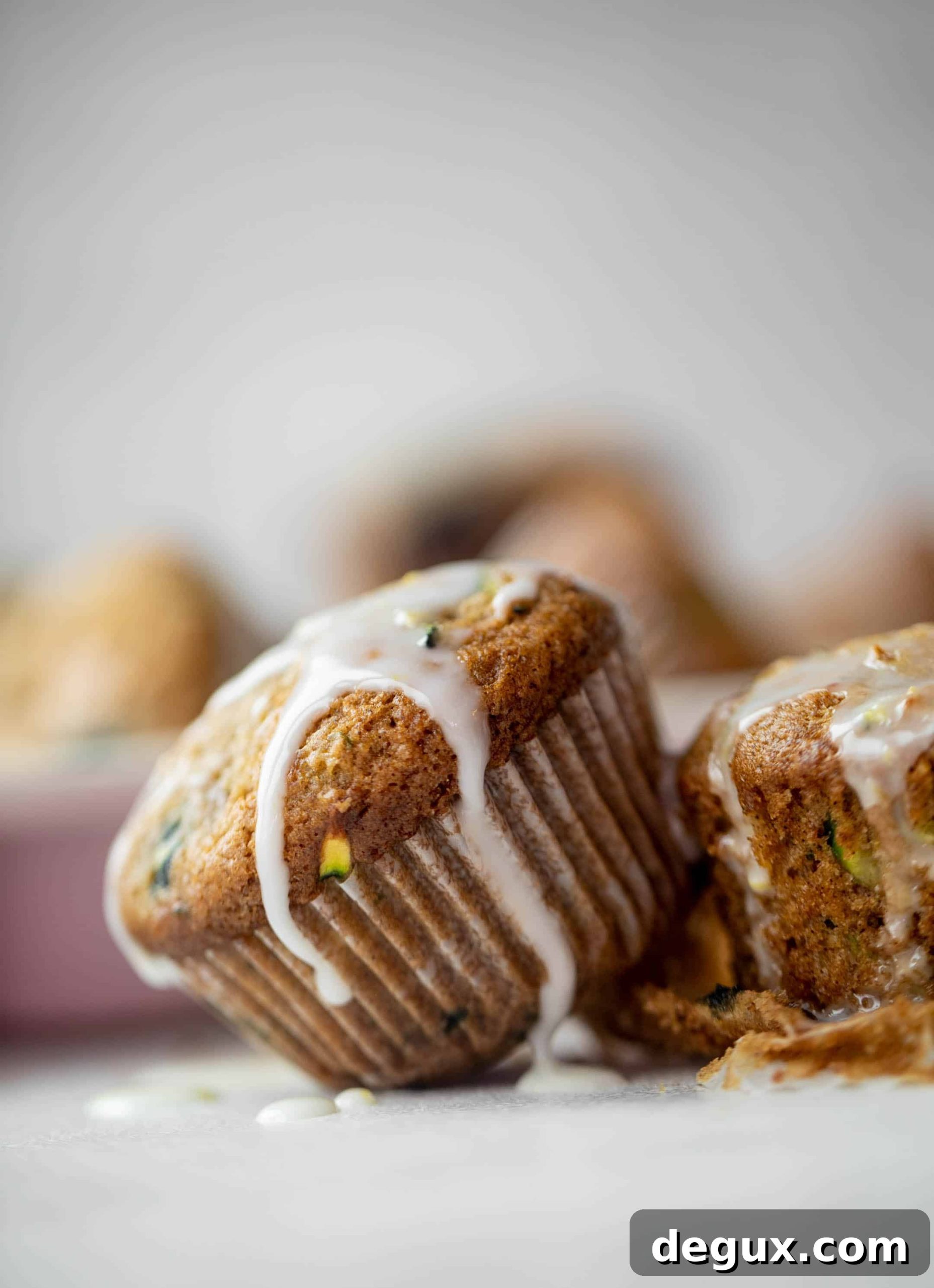blueberry zucchini muffins with lemon glaze