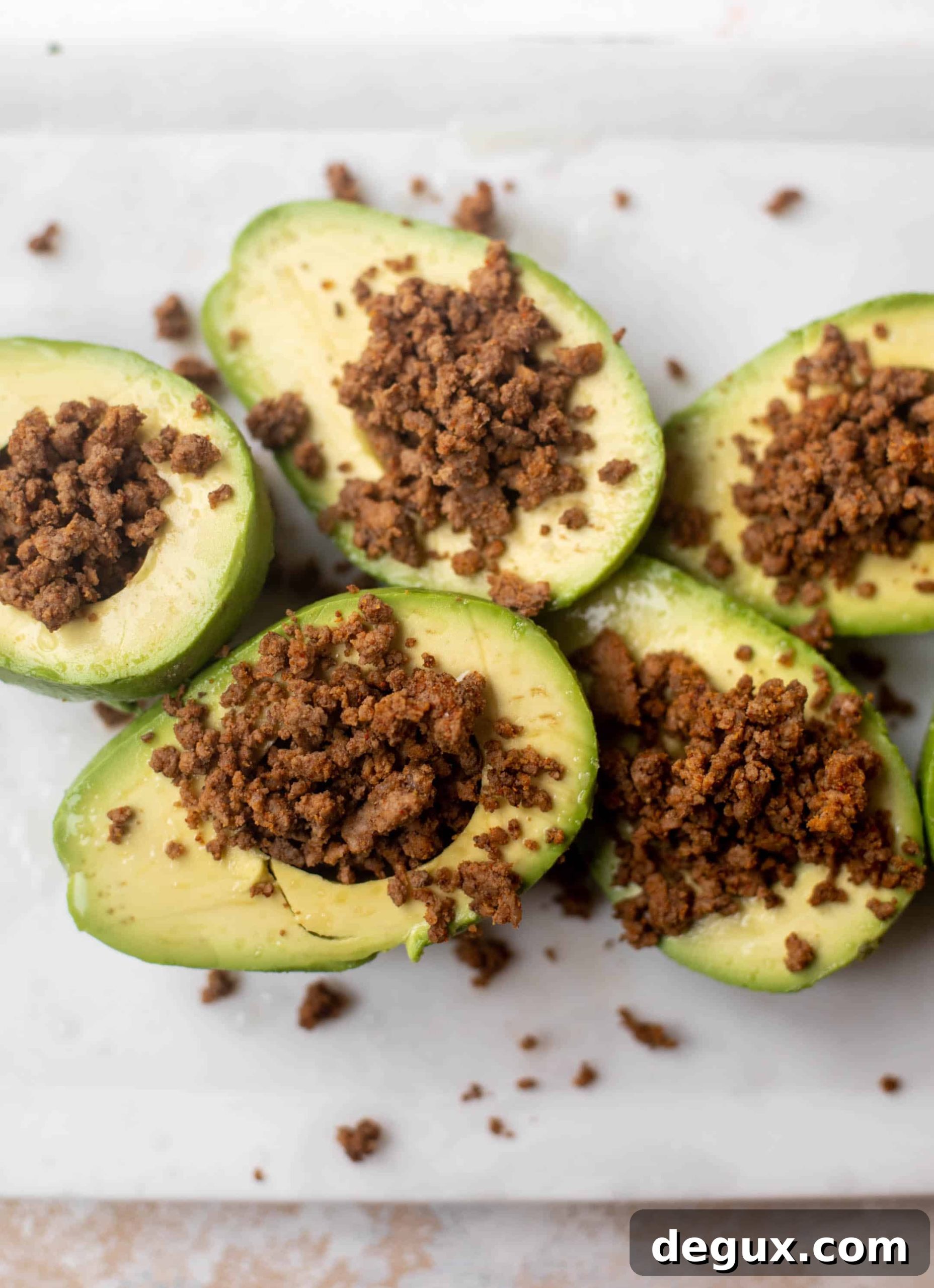 Weeknight Taco-Stuffed Avocados for Quick Family Dinners 6 sliced avocados with taco meat