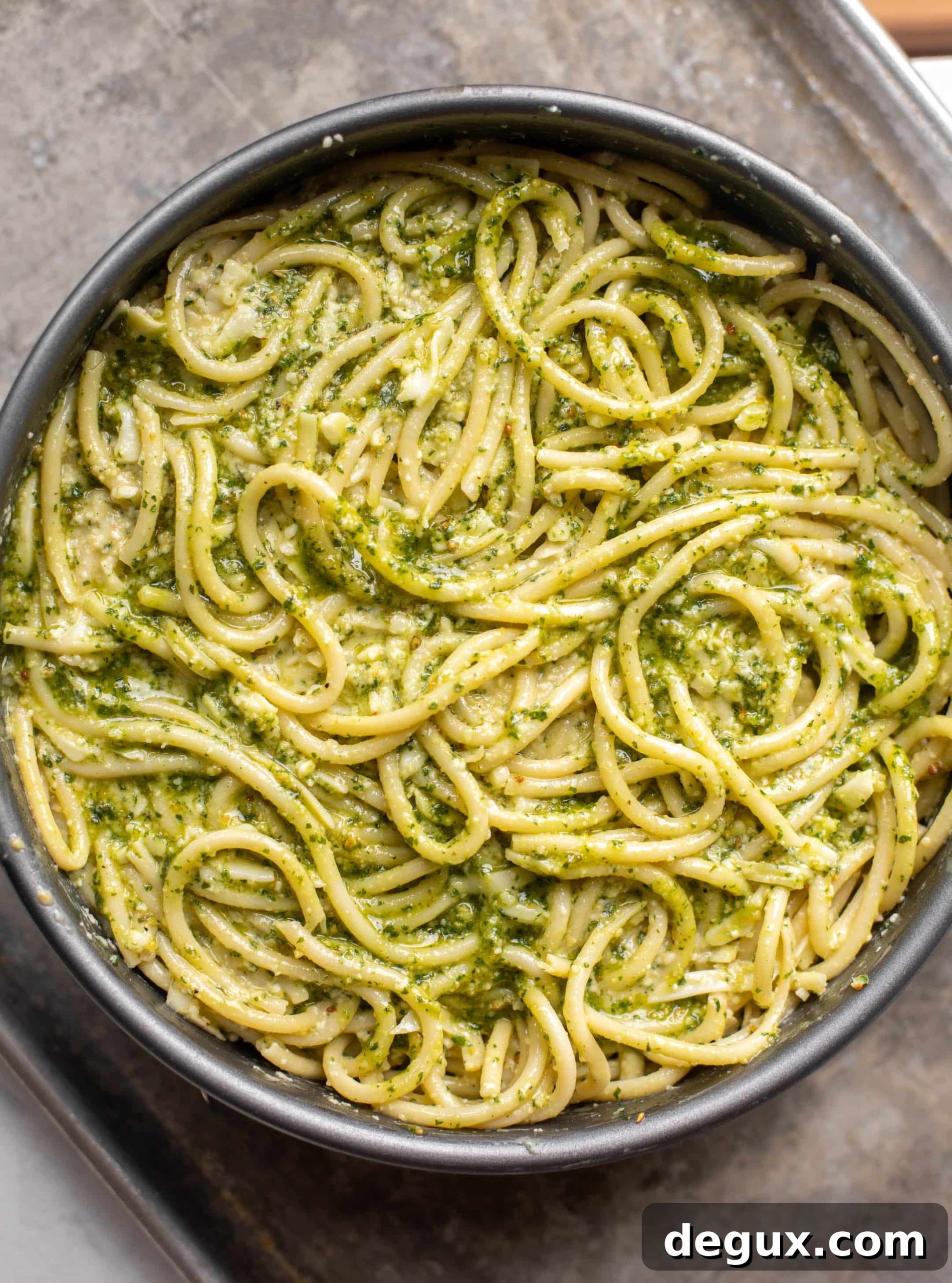 Pesto Bucatini Pie Recipe: Creamy Baked Pasta with Basil 5 pesto pasta pie in a pan