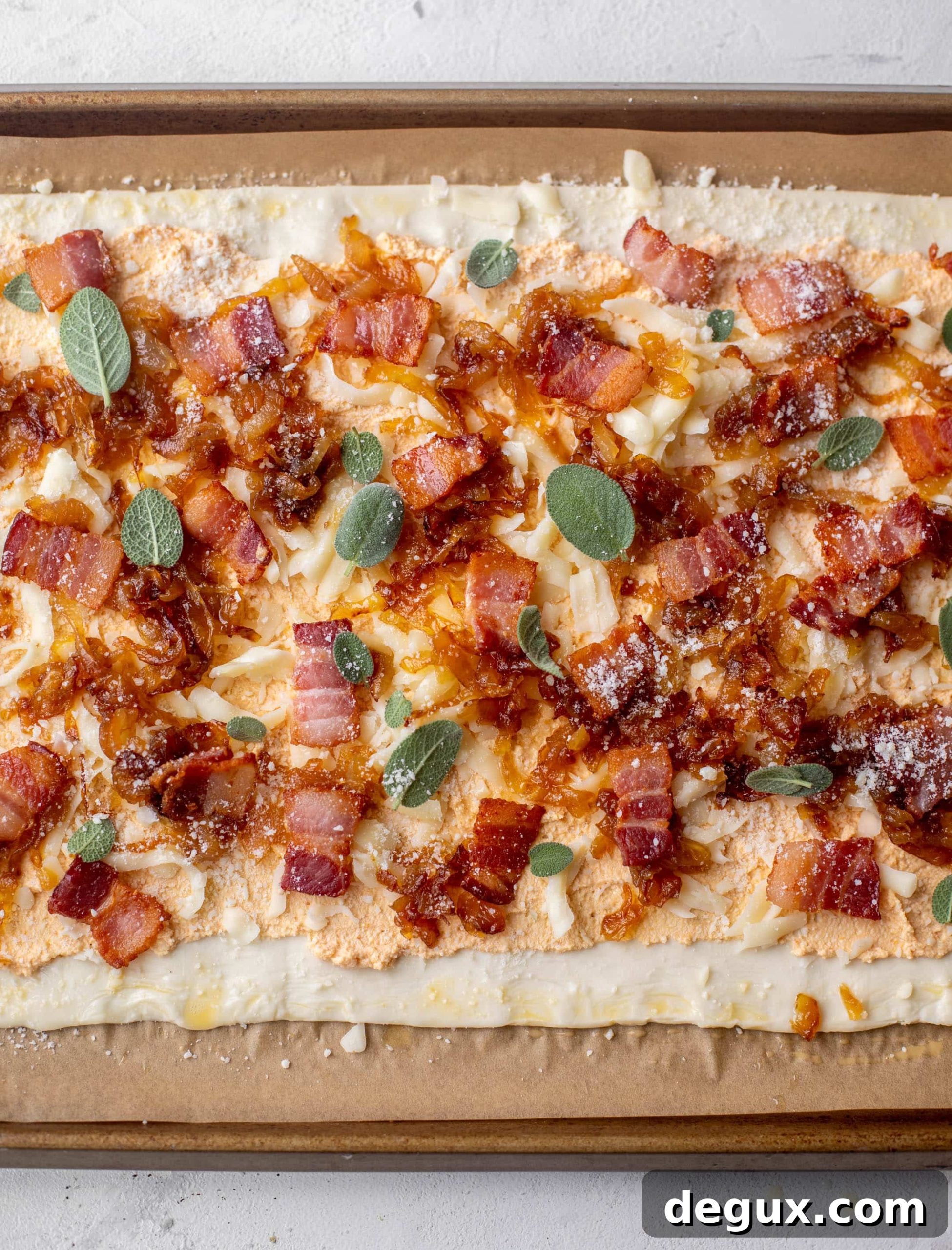 savory pumpkin puff pastry pizza ready for the oven