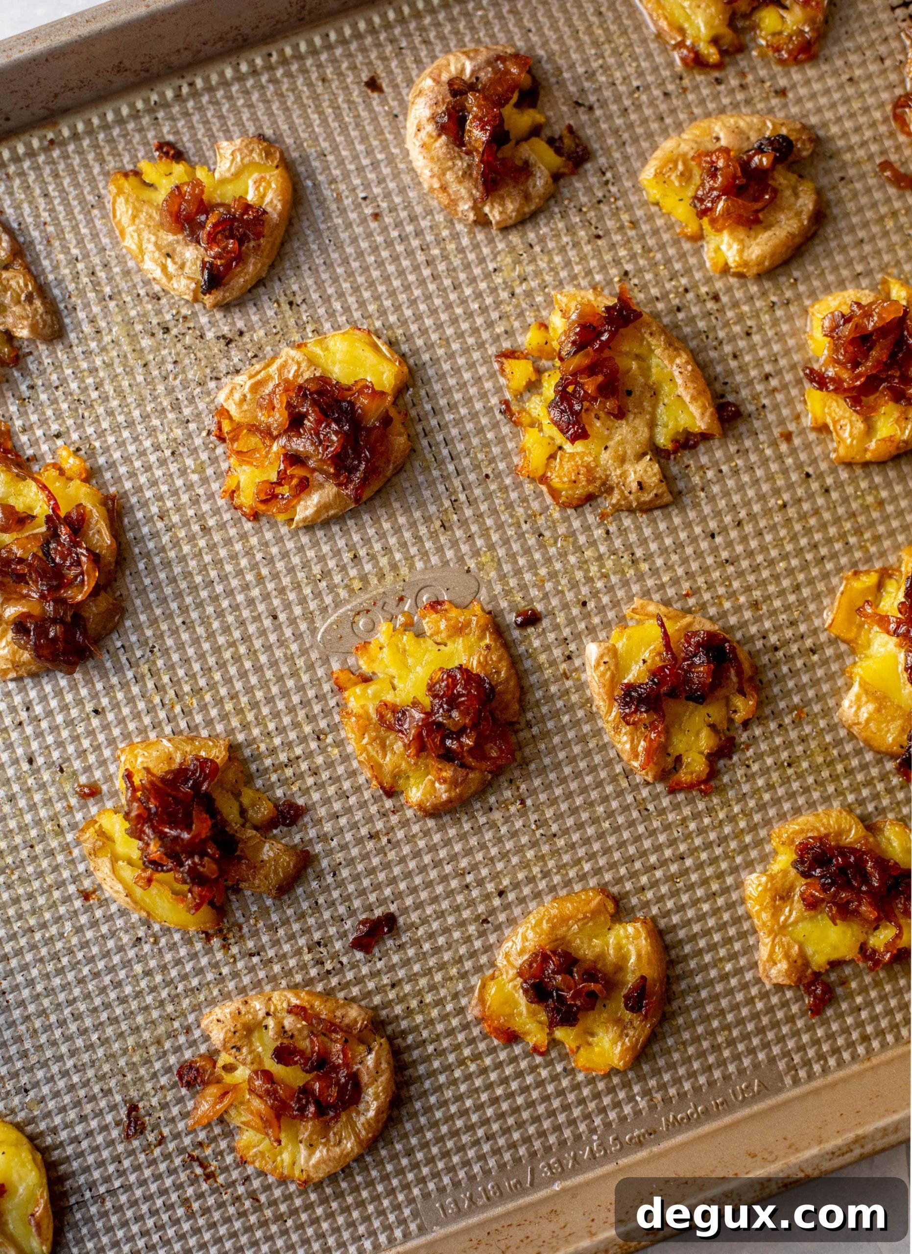 Crispy French Onion Smashed Potatoes Recipe 3 smashed potatoes on a sheet pan