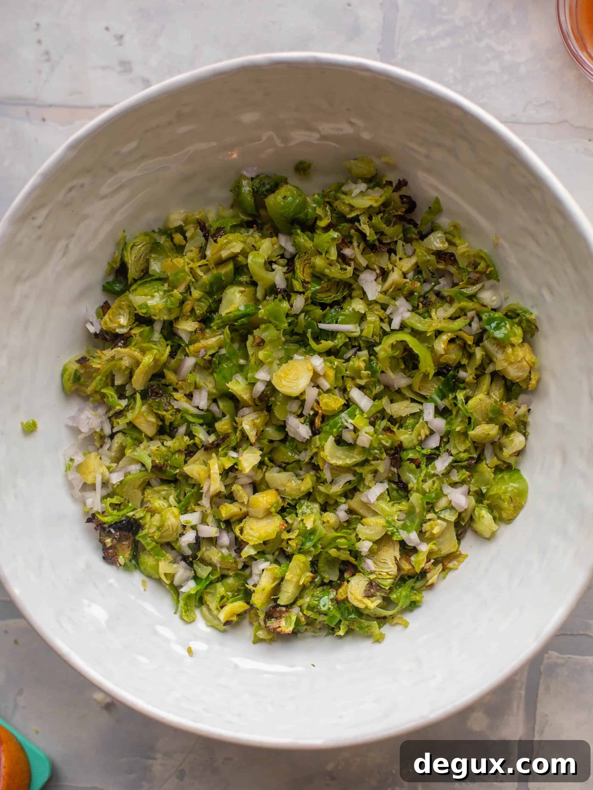 Crispy Brussels Sprout & Blood Orange Salad with Toasted Almonds 4 brussels sprouts in a bowl