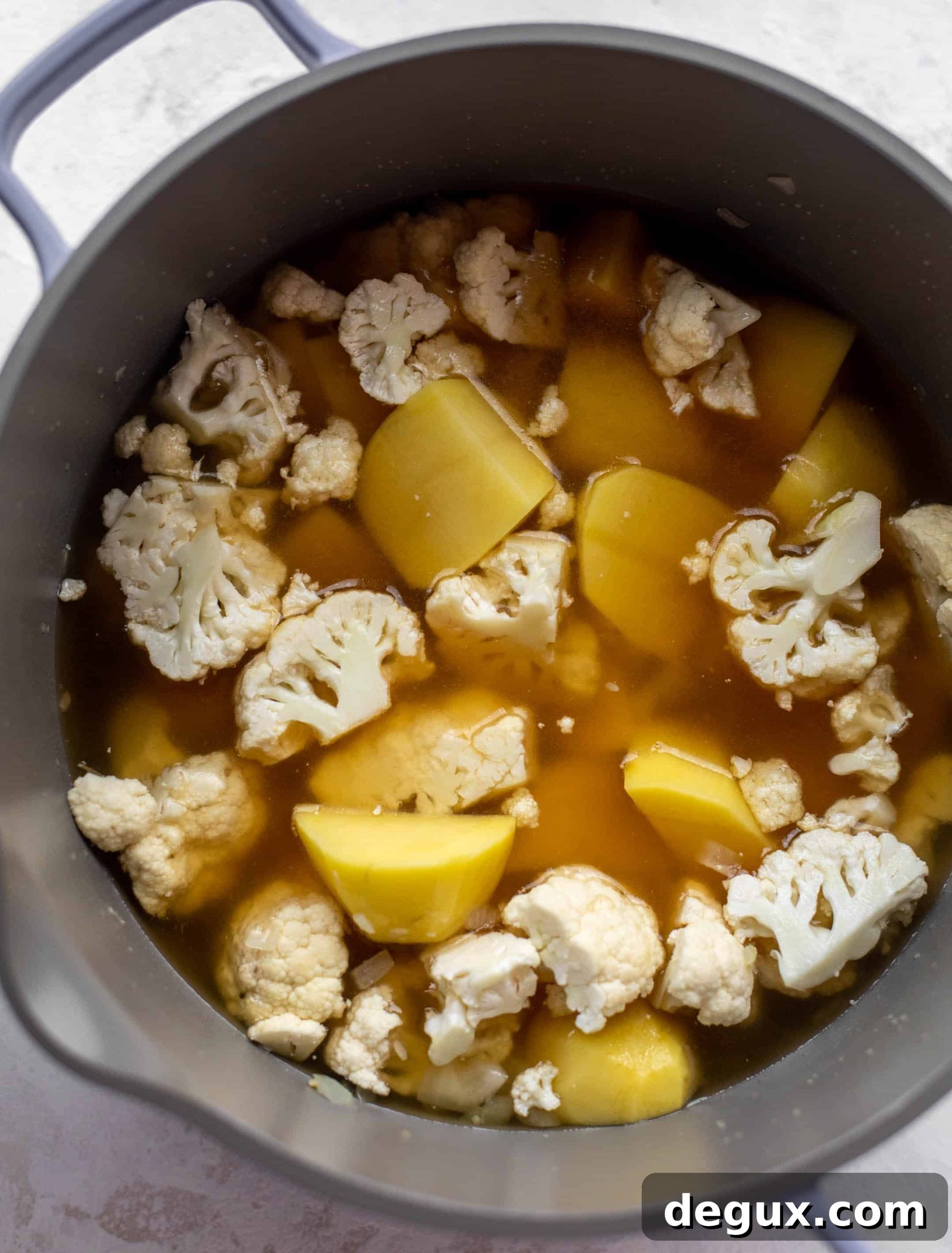 Chipotle Bacon Cauliflower and Potato Soup Recipe 3 cauliflower and potatoes in stock