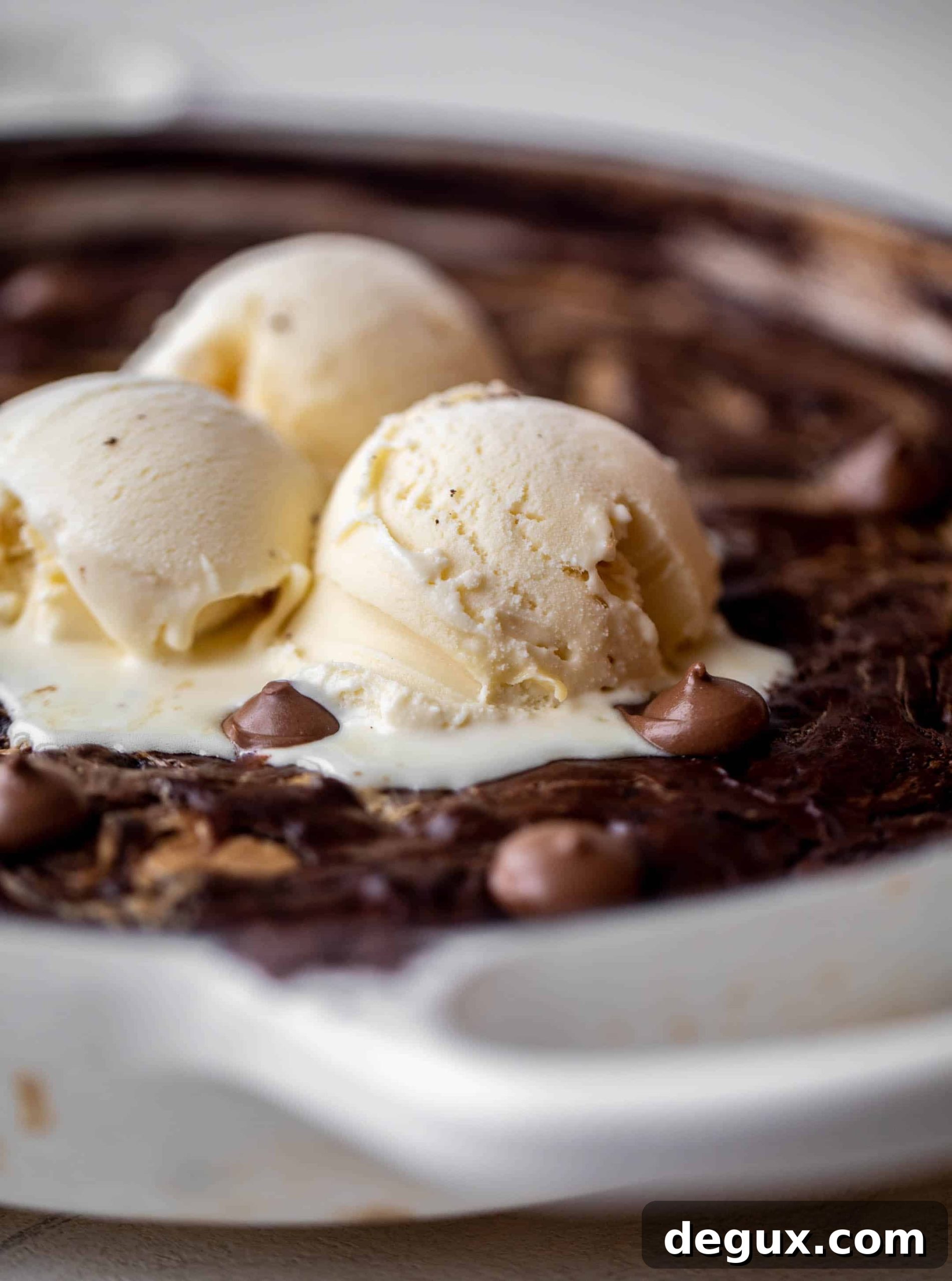 ice cream melting on chocolate peanut butter skillet brownie
